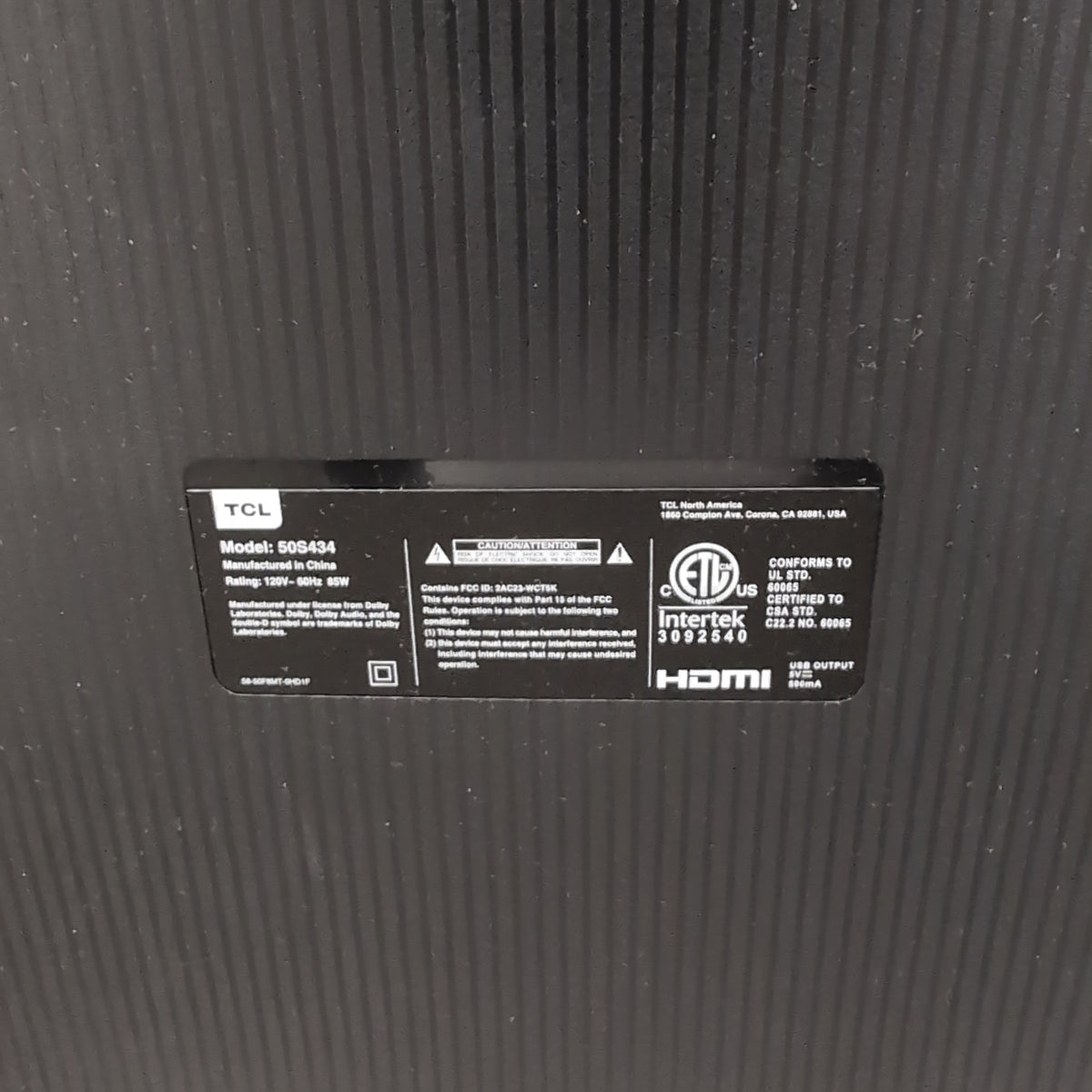 Black TCL Flat-Screen TV with Stand