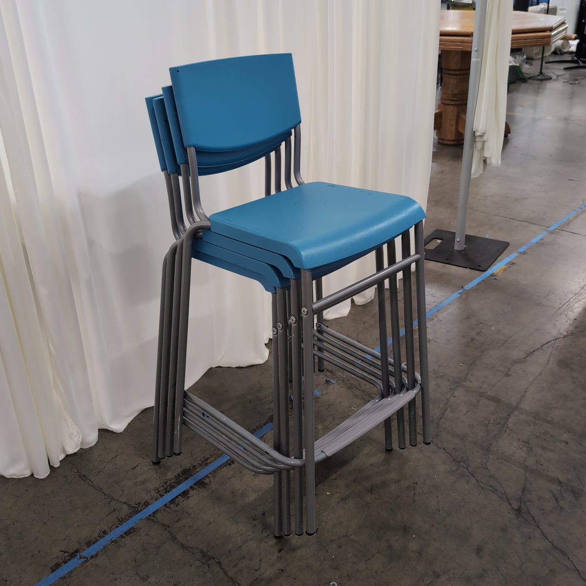 Set of Four Stackable Blue Plastic Chairs