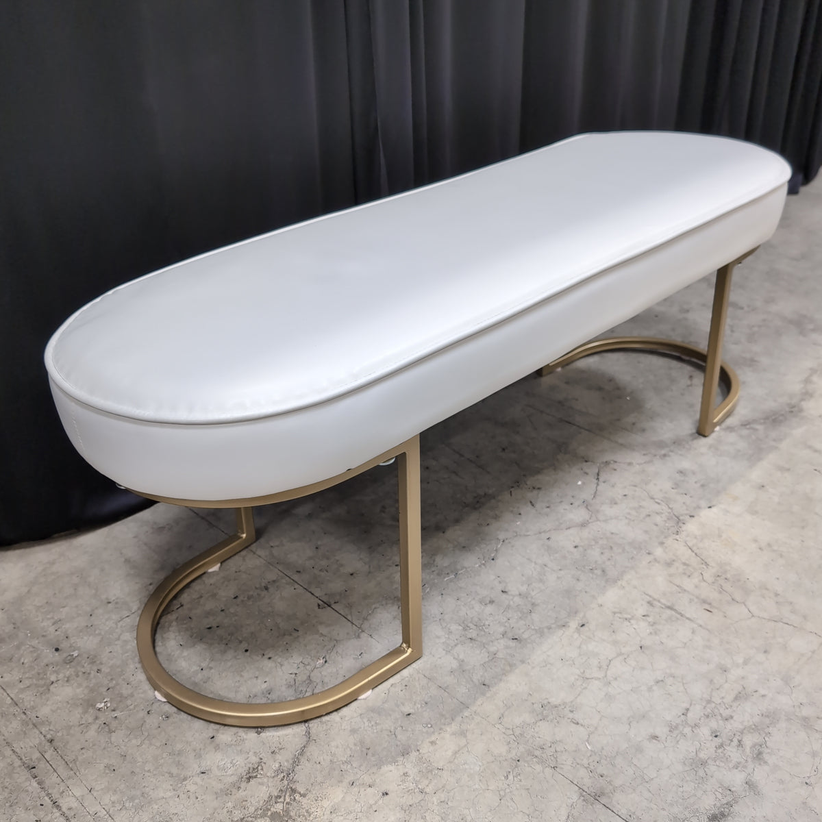 White Upholstered Oval Bench with Gold Base