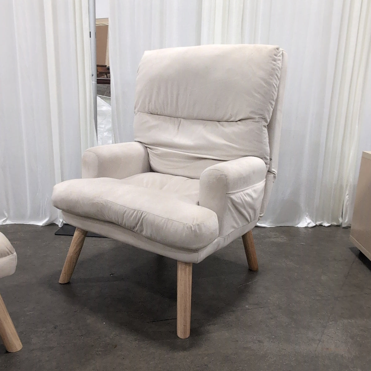 Cream Upholstered Four-Cushion Ottoman with Tapered Legs