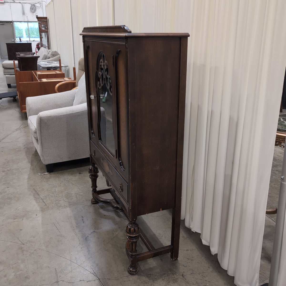 Ornate Dark Wood China Cabinet with Scrollwork