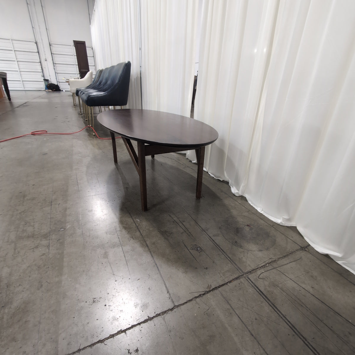 Oval Dark Wood Dining Table with Angled Legs