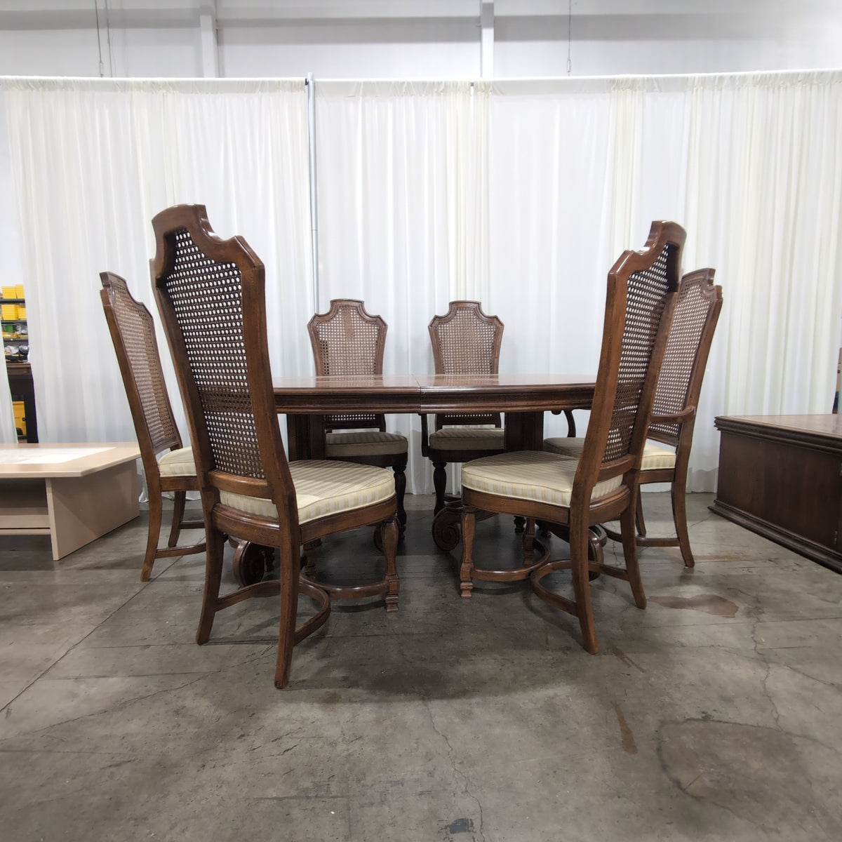 Ornate Brown Wood Dining Table With Six Cane Back Chairs