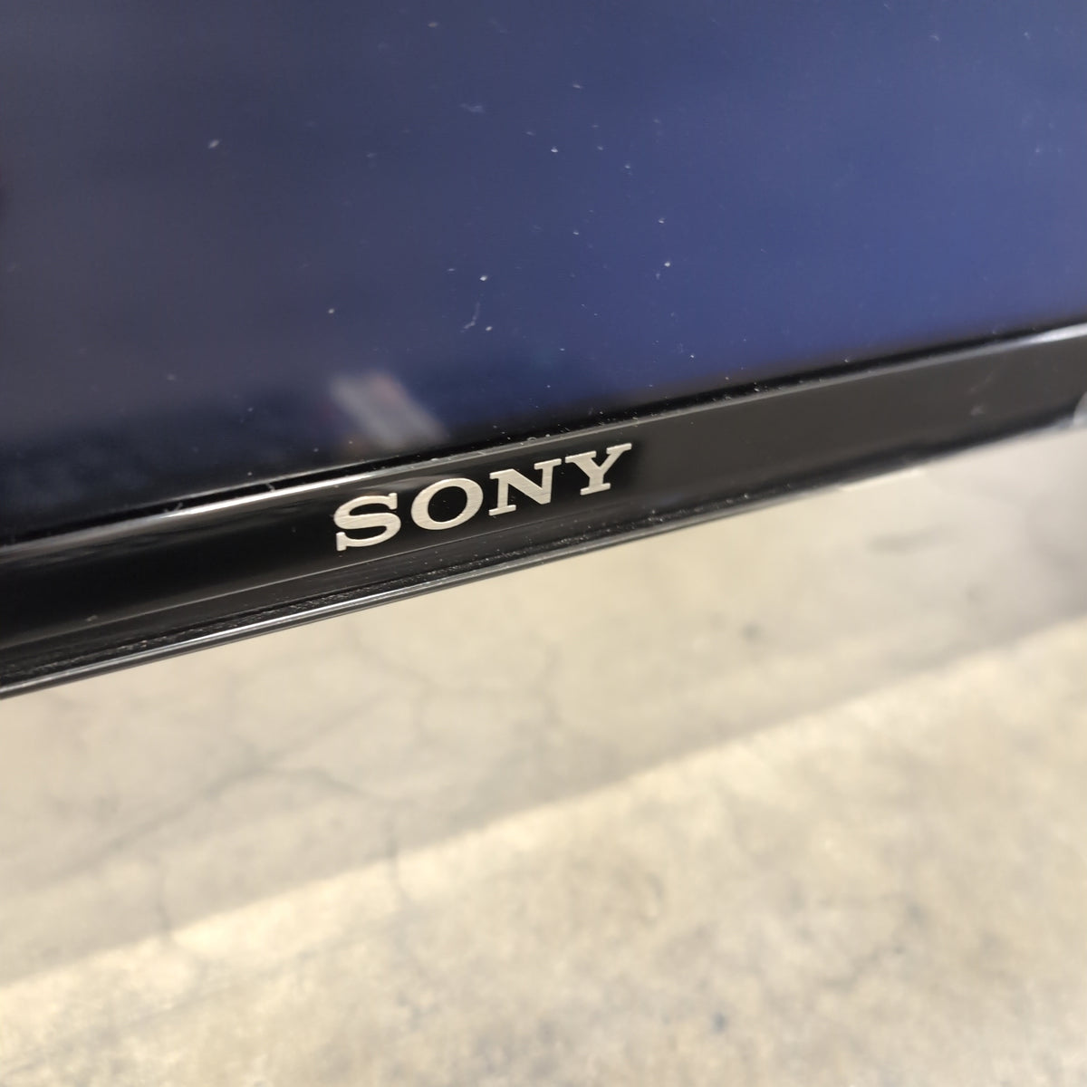 Modern Black Sony TV with Remote