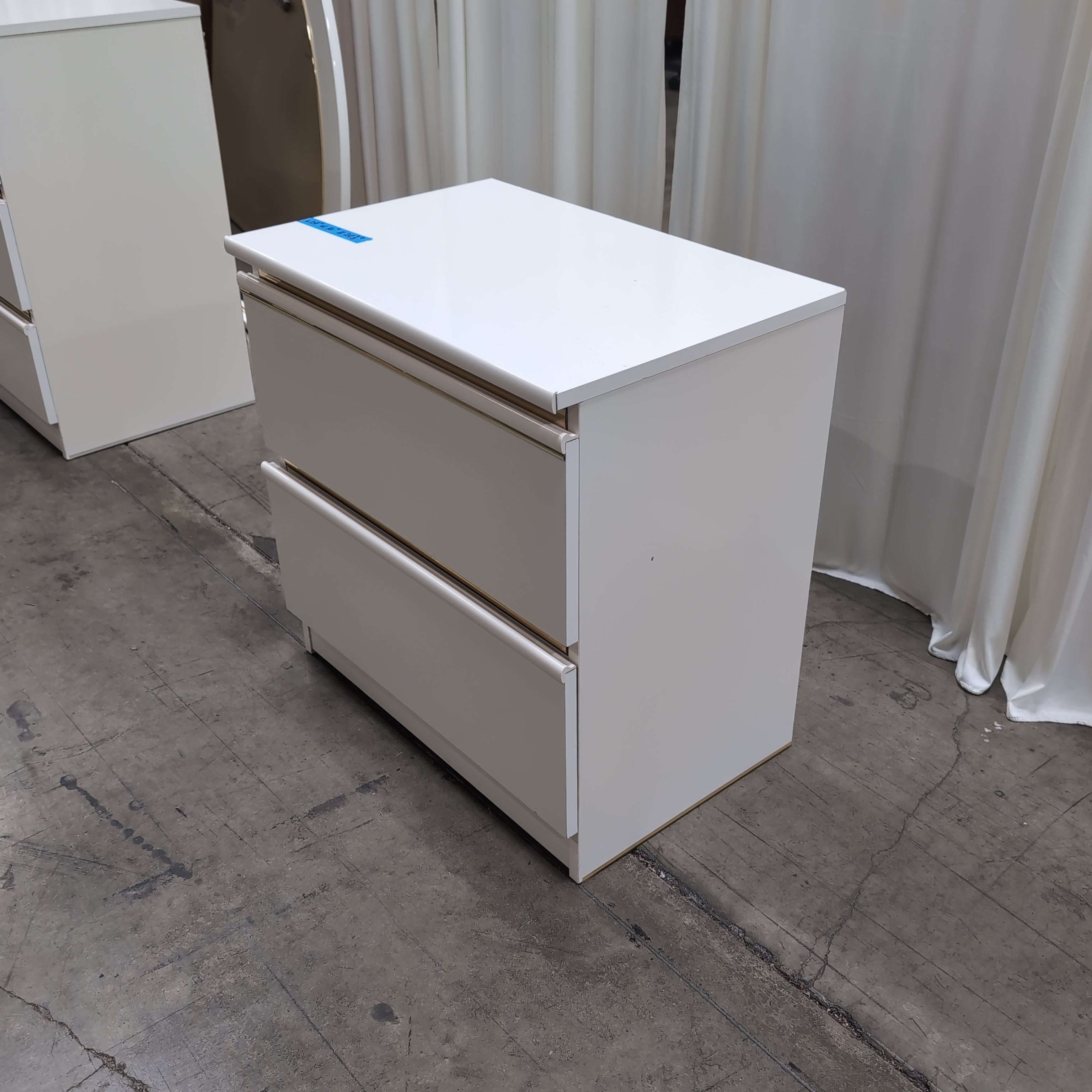White Two-Drawer Nightstand with Gold Accents