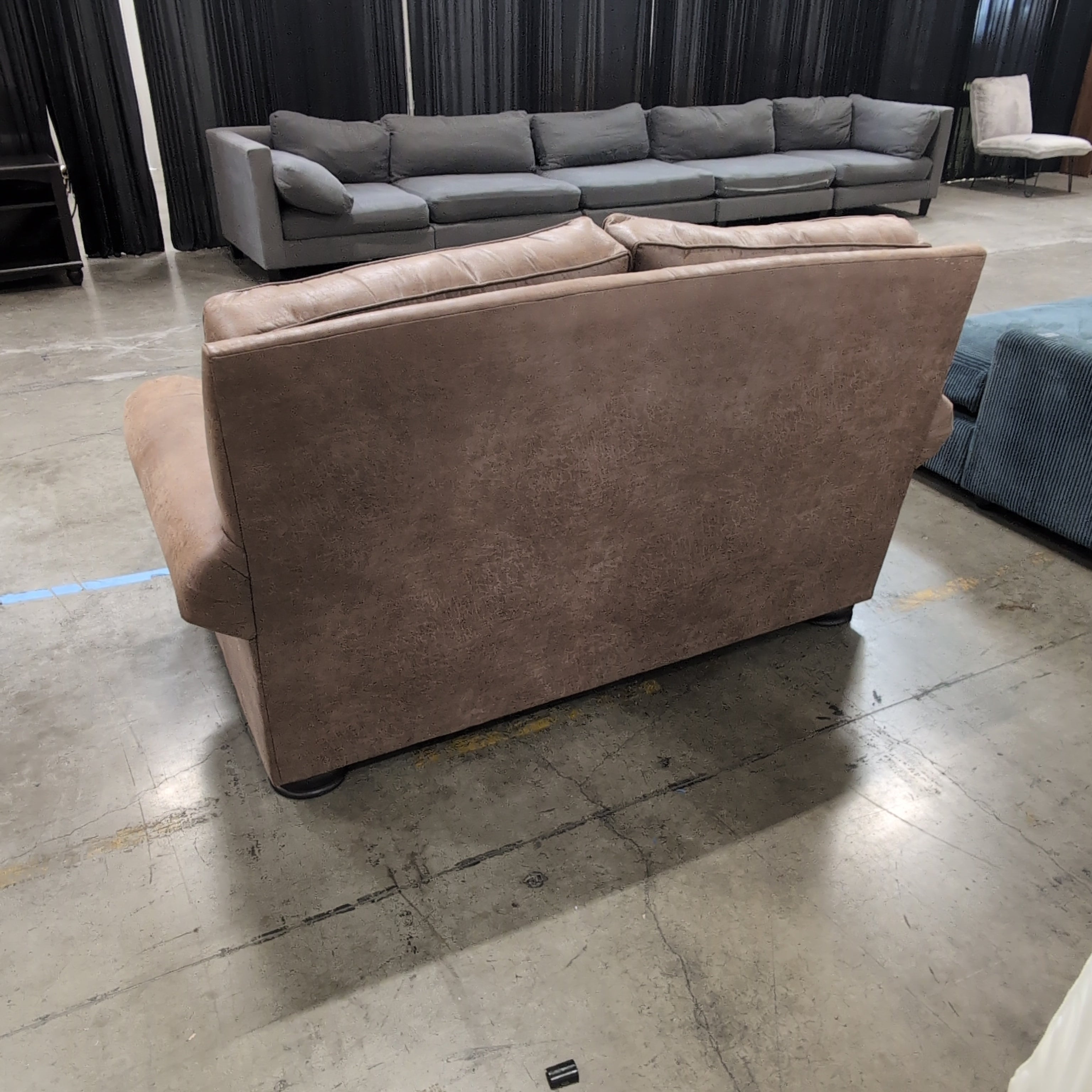 Tan Faux Leather Rolled Arm Loveseat with Nailhead Trim
