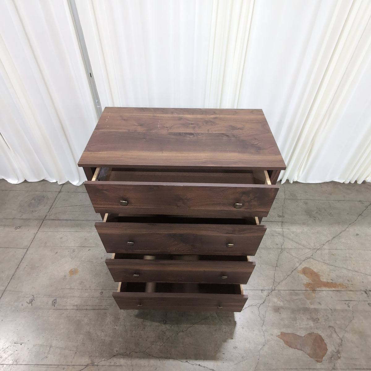 Dark Wood Four-Drawer Dresser with Metal Pulls
