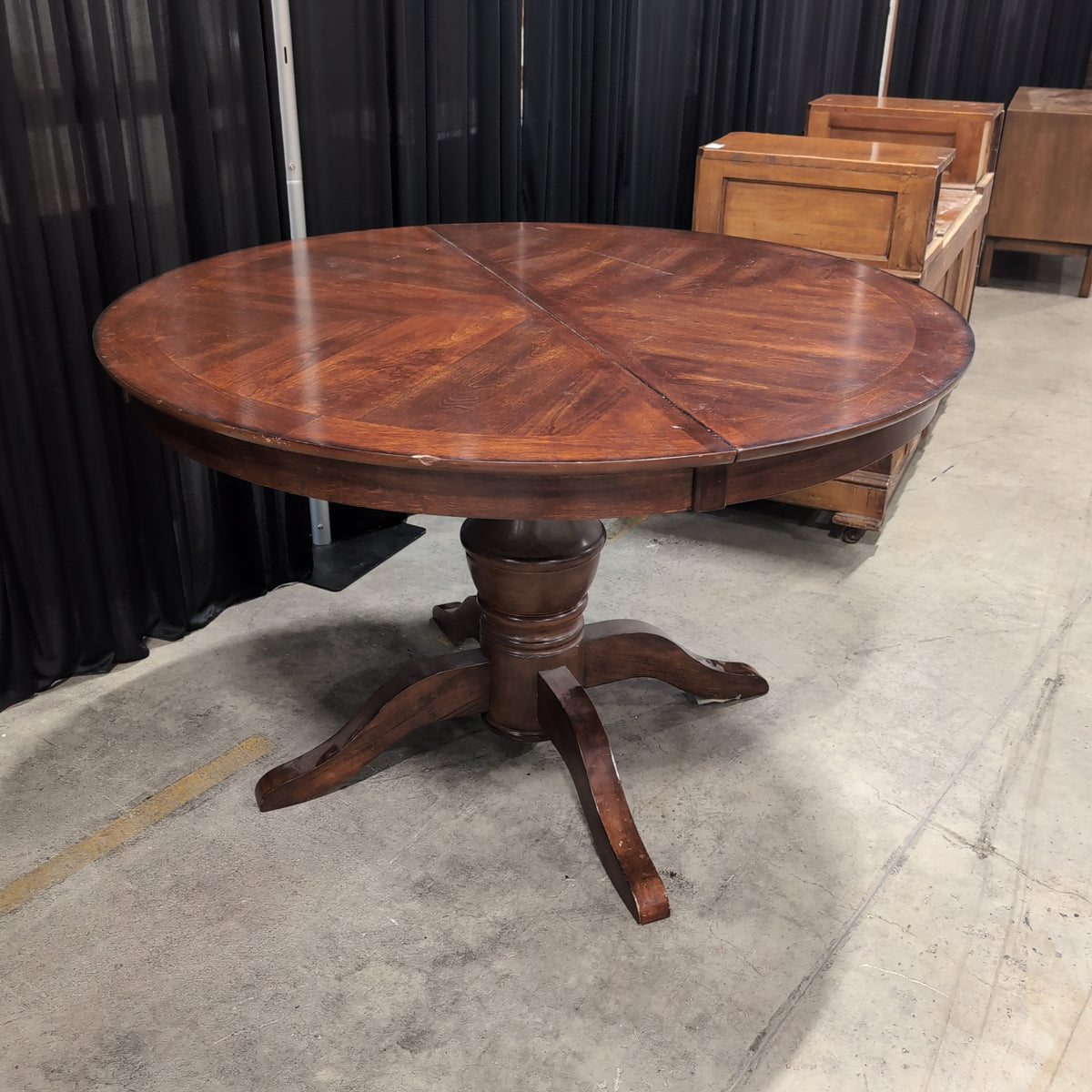 Round Dark Wood Dining Table with Pedestal Base