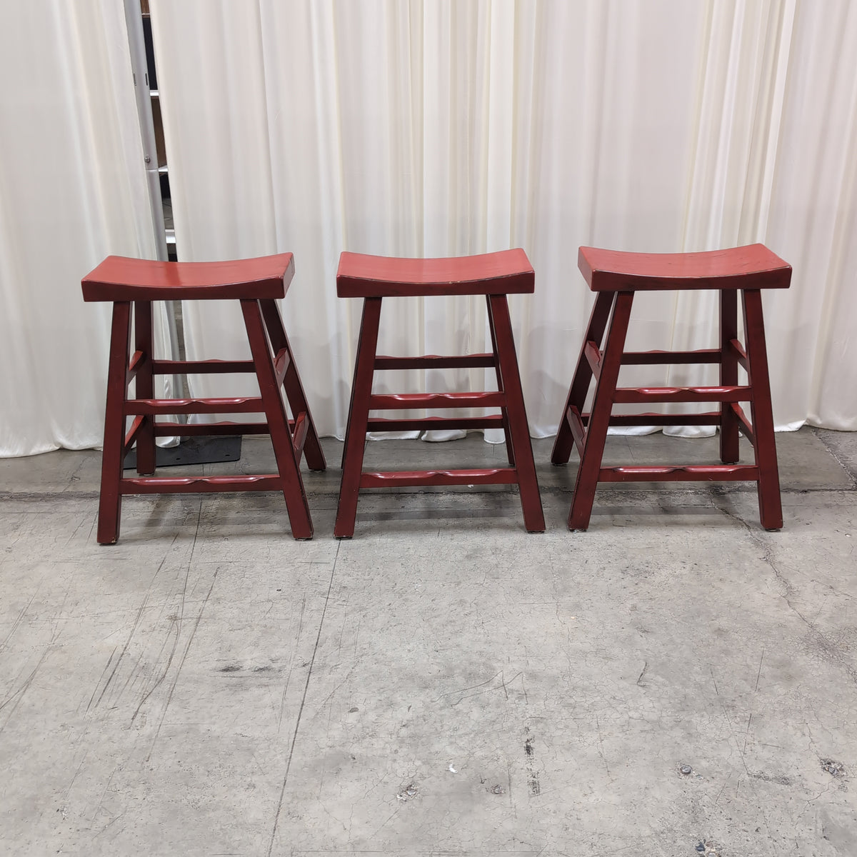 Red Wood Saddle Seat Bar Stool