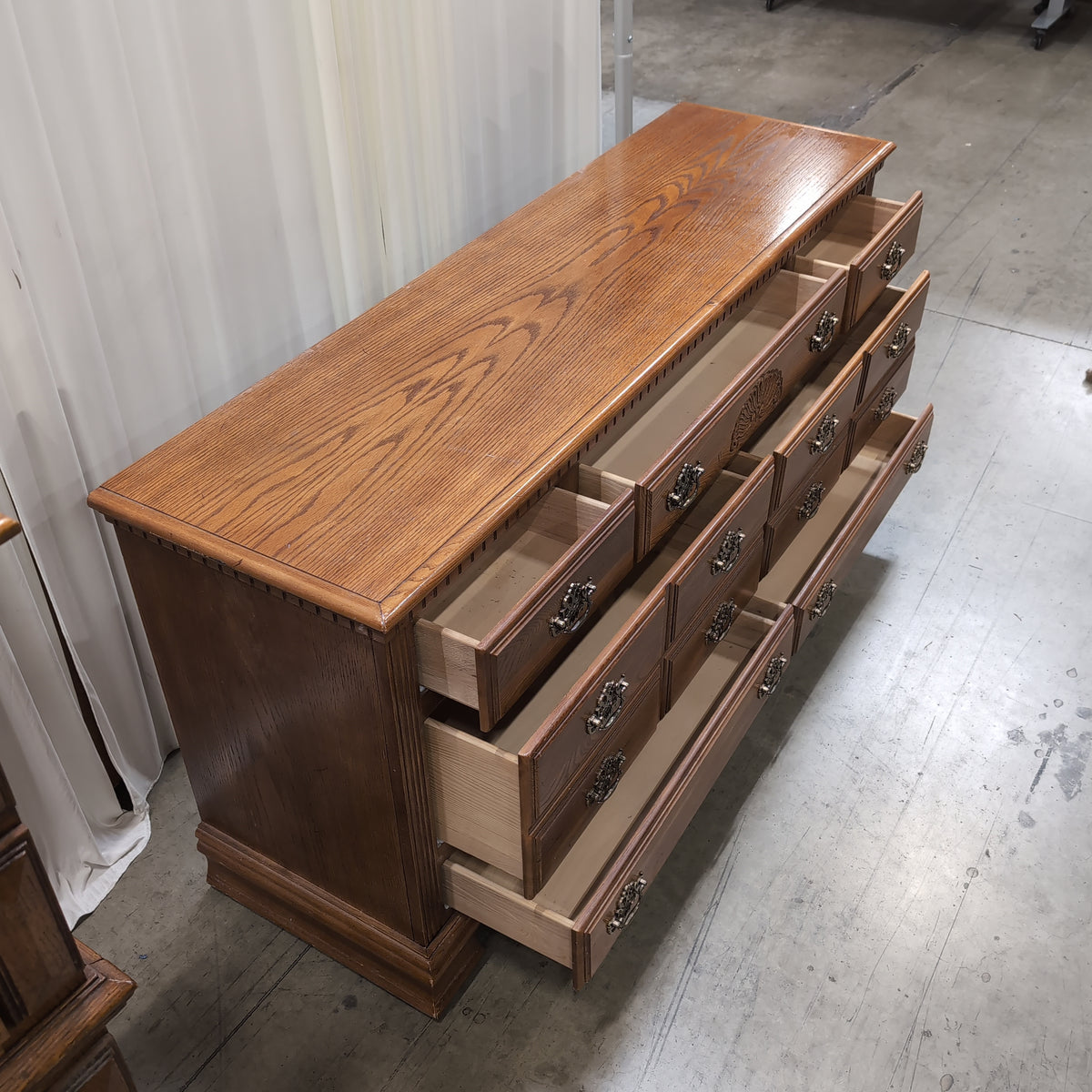Traditional Brown Wood Dresser with Ornate Hardware