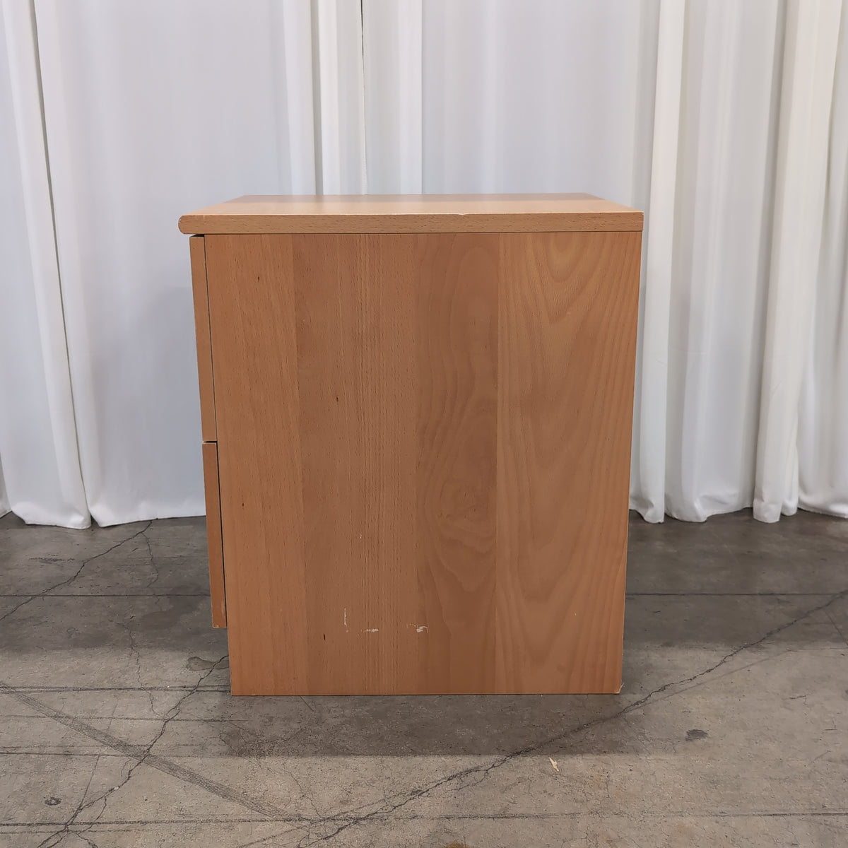 Light Wood Two-Drawer Nightstand with Silver Knobs
