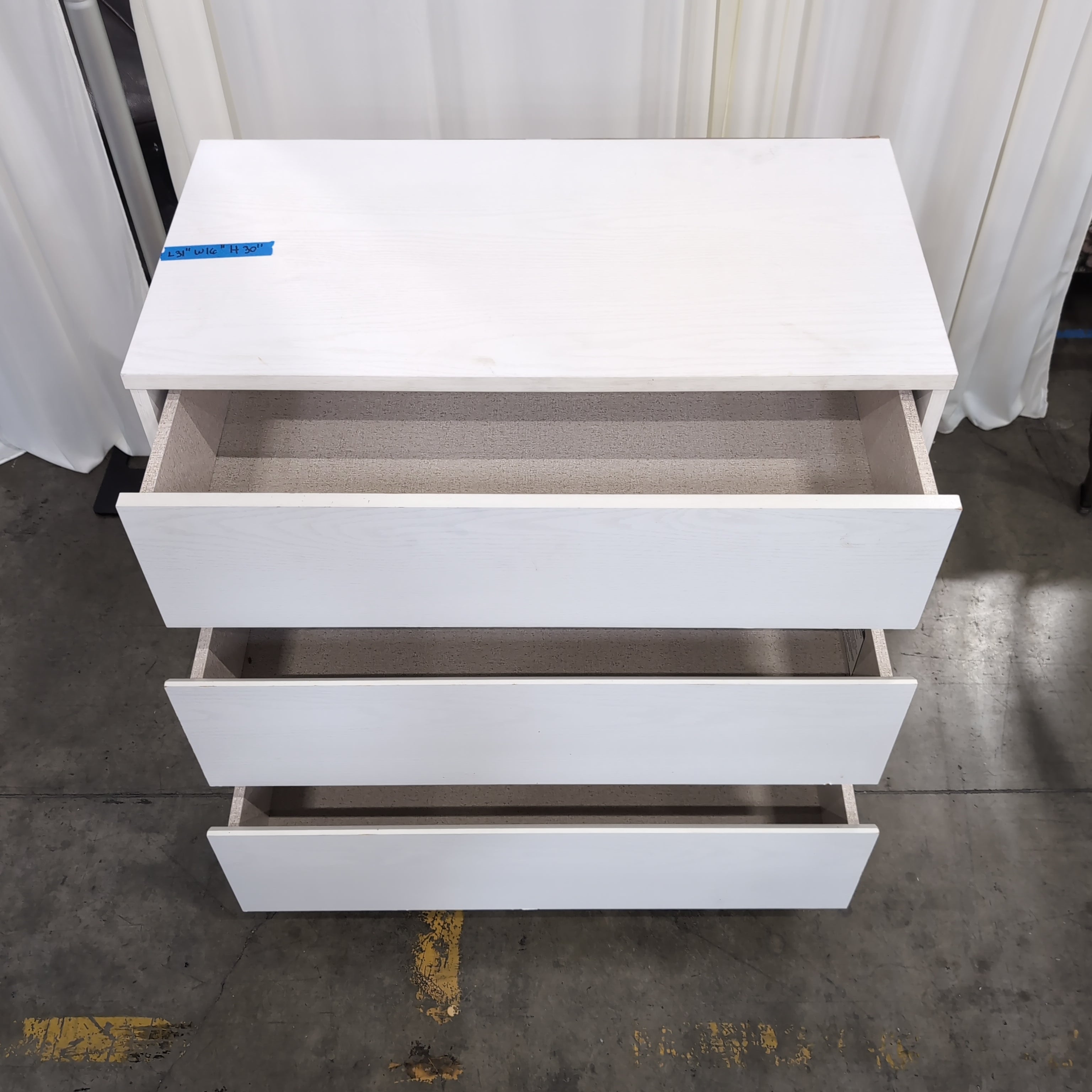 White Three-Drawer Dresser in Wood Finish