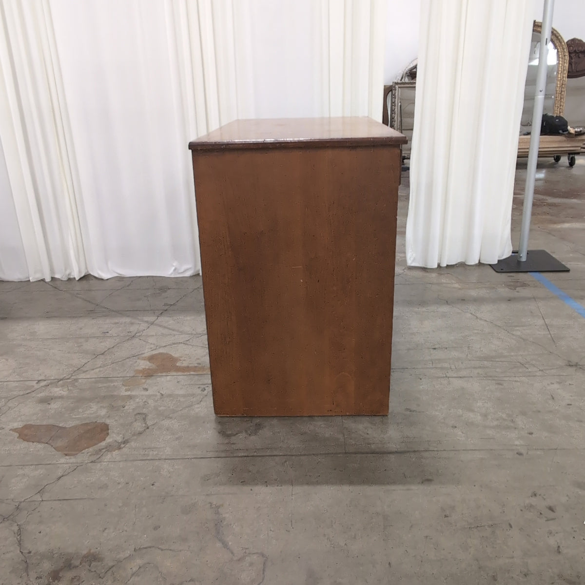 Brown Wood Four-Drawer Desk with Round Knobs