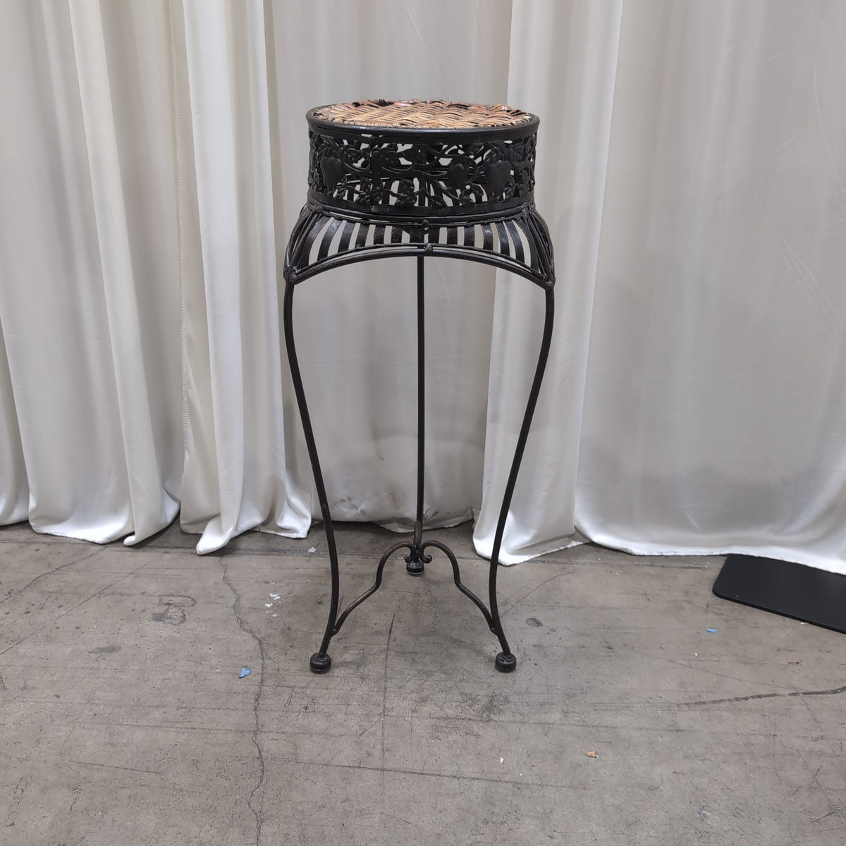 Ornate Dark Metal Plant Stand with Woven Top