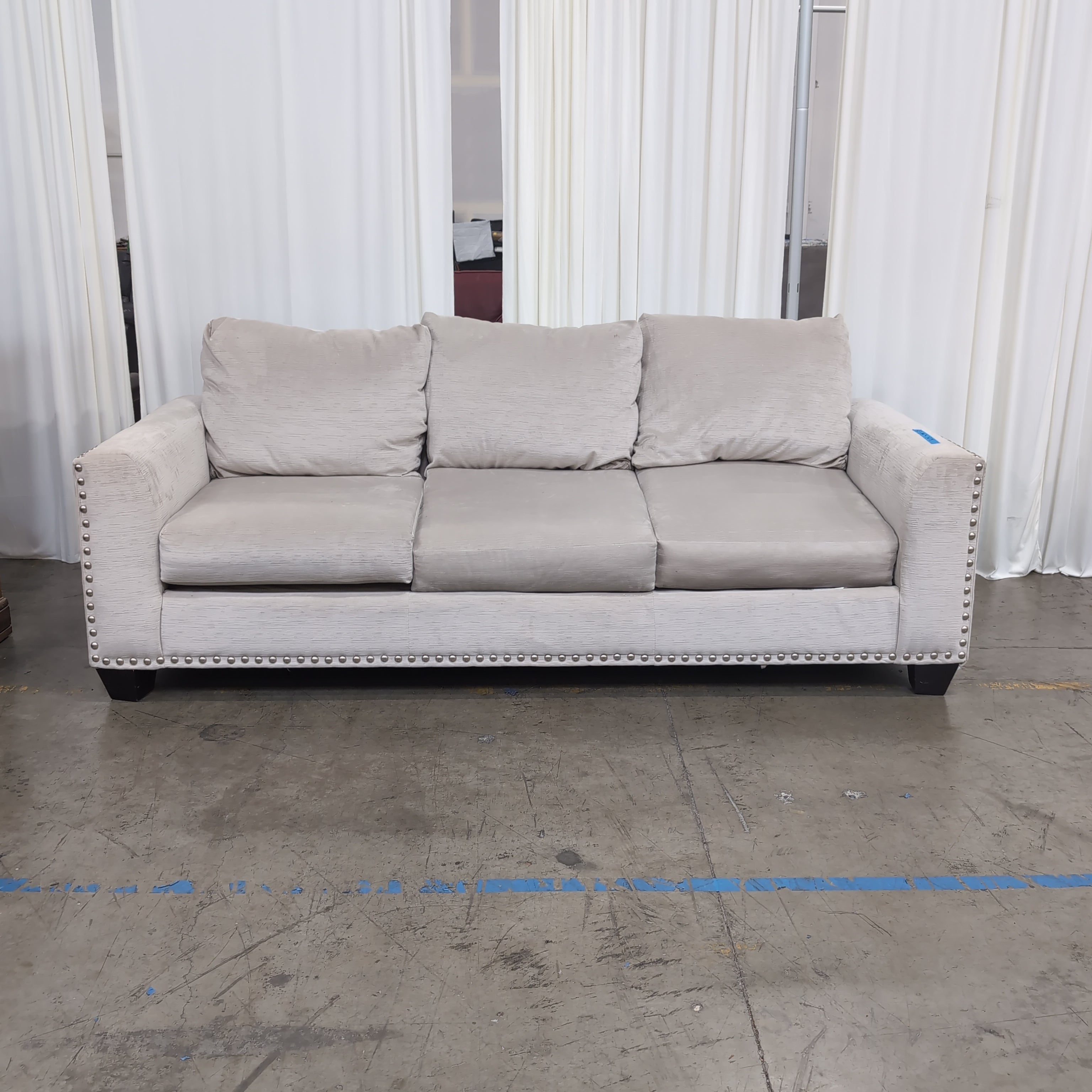 Light Beige Microfiber Couch with Nailhead Trim