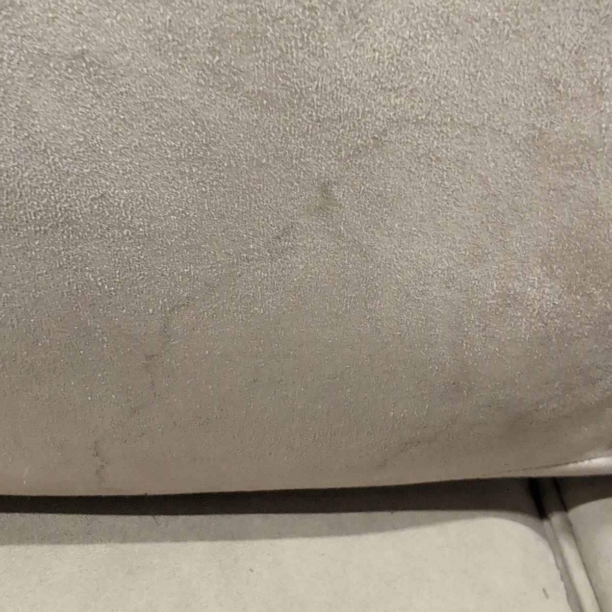 Beige Upholstered Three-Seat Couch with Rolled Arms