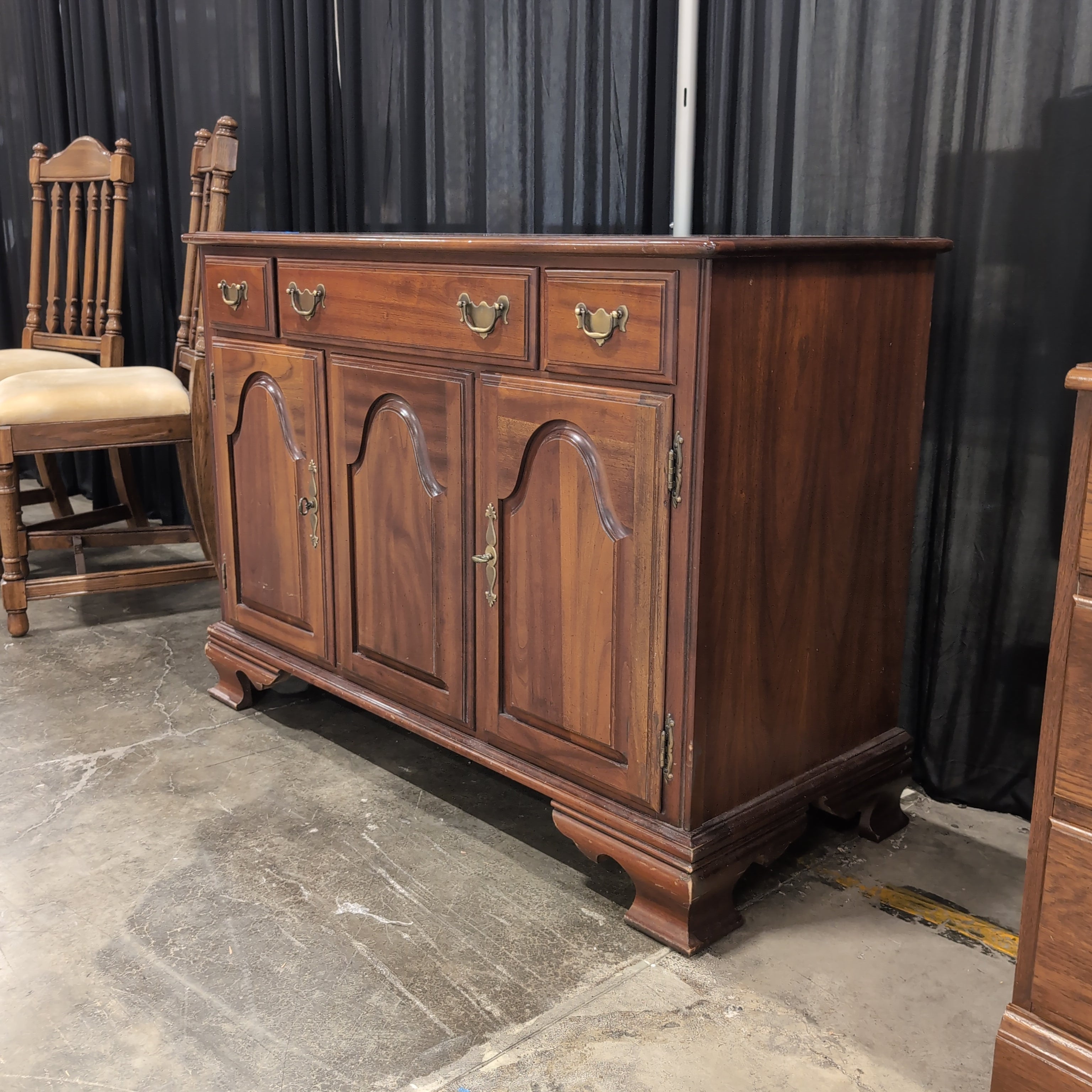 Traditional Cherry-Toned Wood Buffet with Ornate Hardware