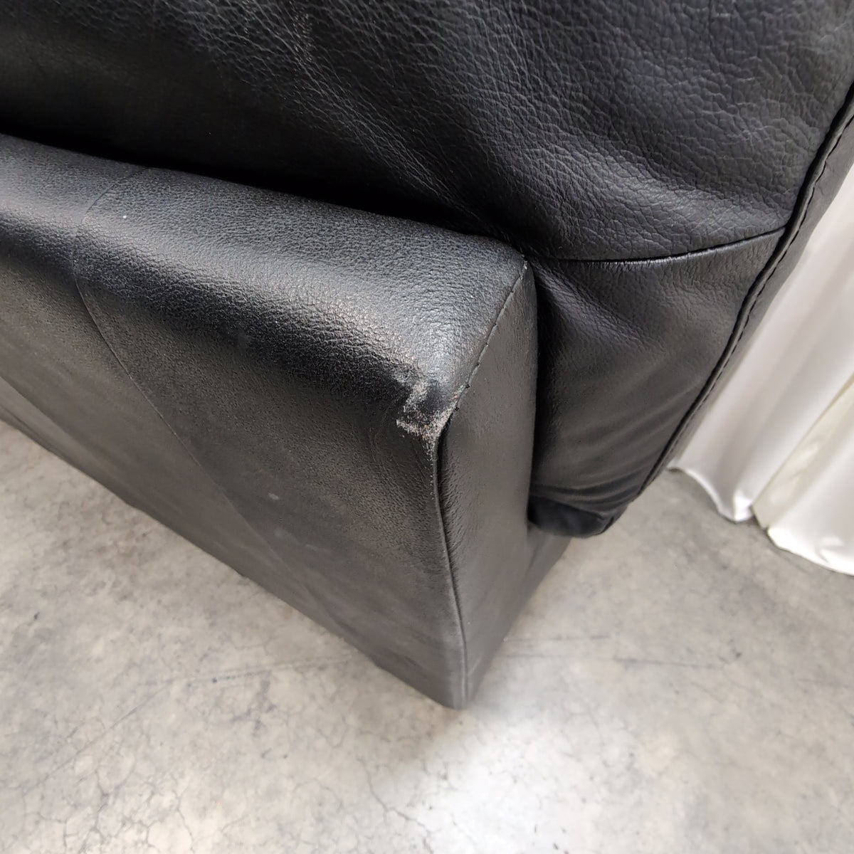 Black Leather Three-Seat Couch with Padded Arms