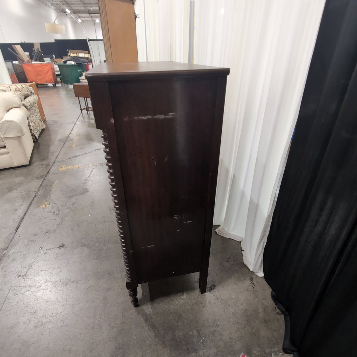 Dark Wood Four-Drawer Dresser with Turned Columns