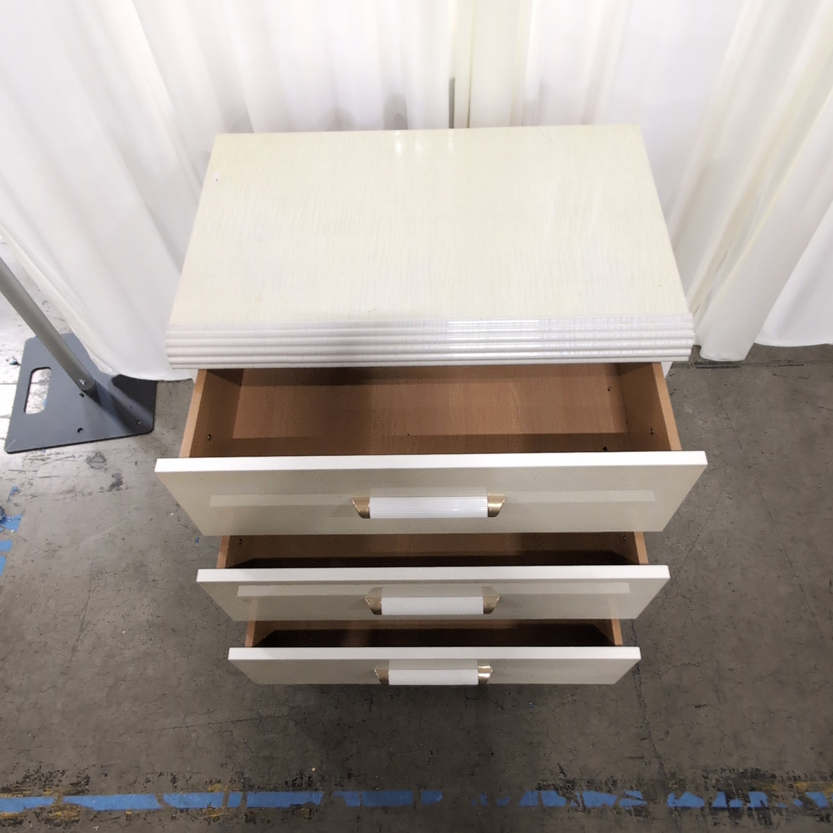 Light Beige Glossy Three-Drawer Nightstand with Ribbed Top