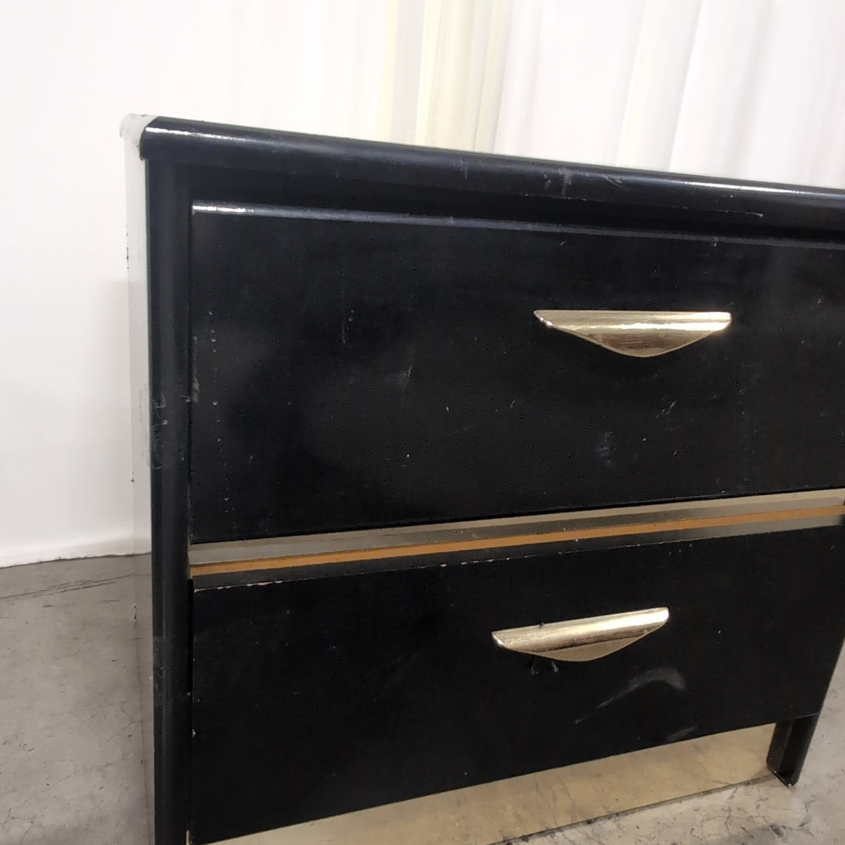 Black Lacquer Four-Drawer Dresser with Gold Pulls