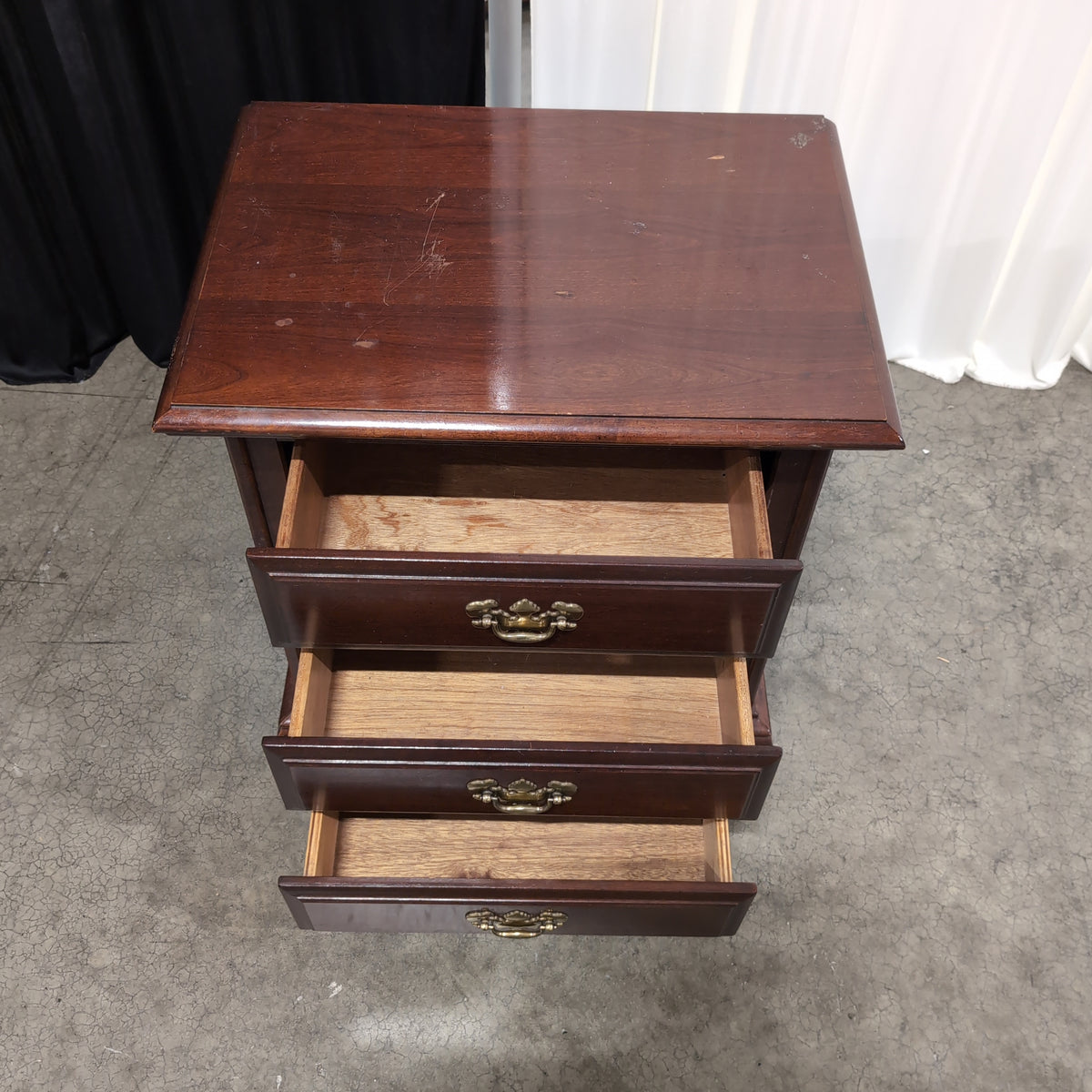 Dark Cherry Wood Nightstand with Ornate Hardware