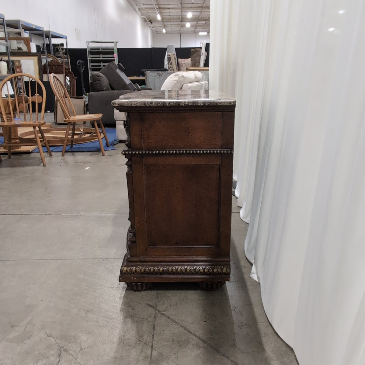 Ornate Dark Wood Three-Drawer Nightstand with Marble Top