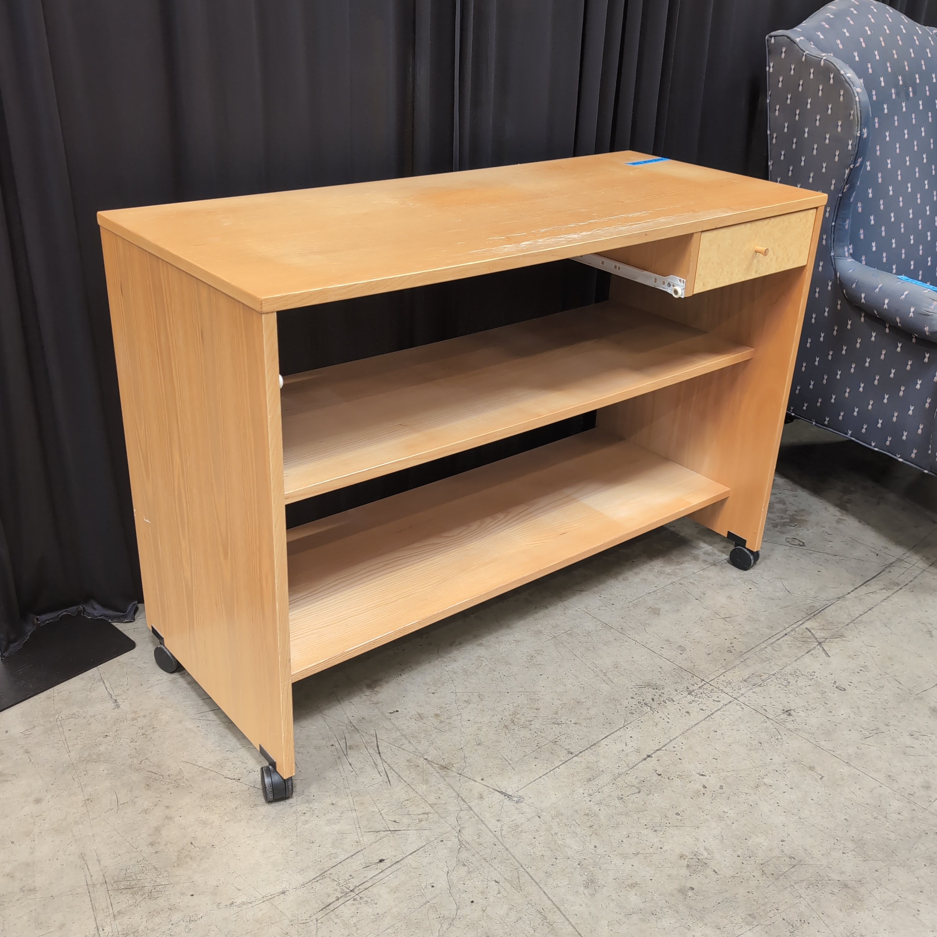 Light Wood Three-Shelf Bookcase with Casters
