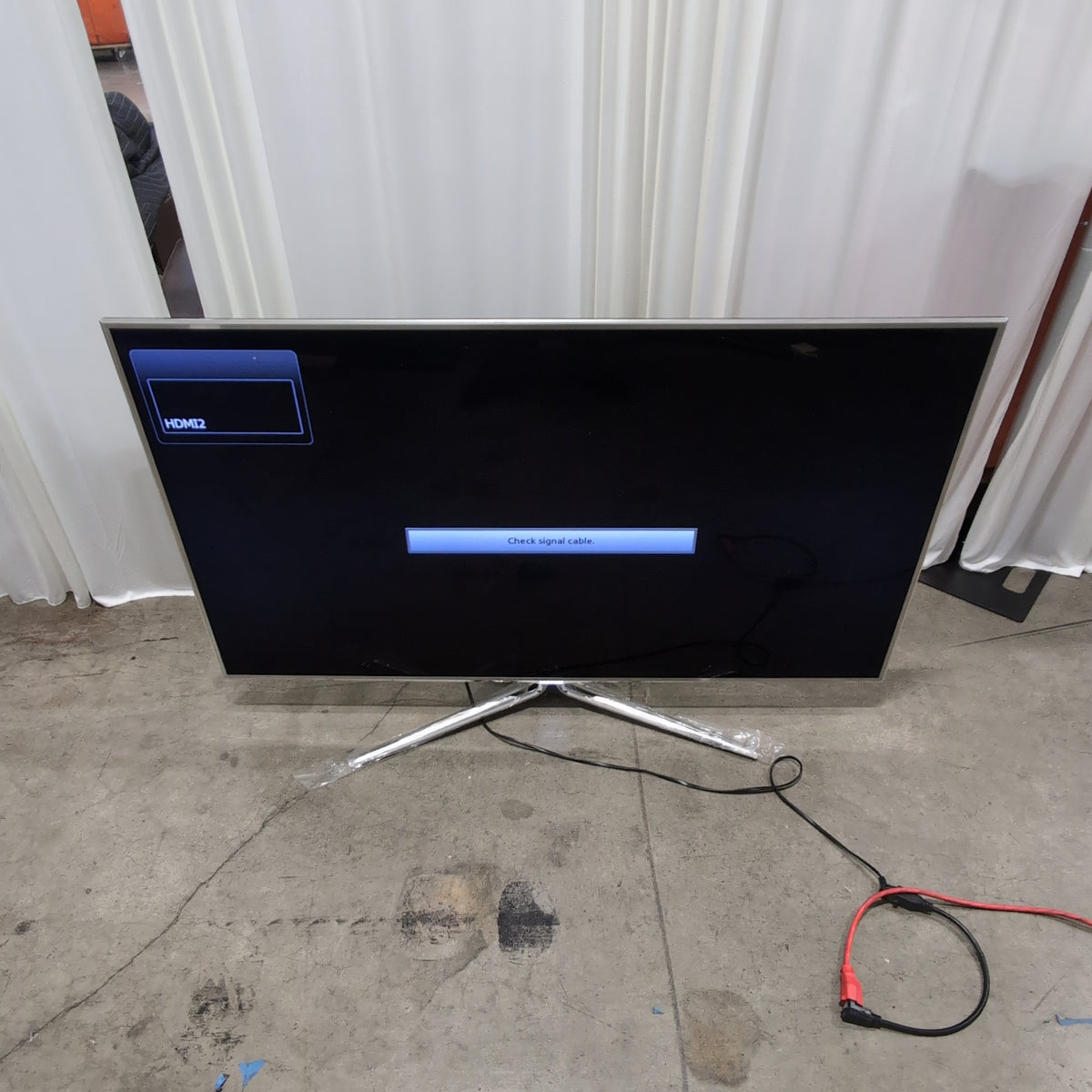 Samsung Modern Black Flat-Screen TV with Silver Stand