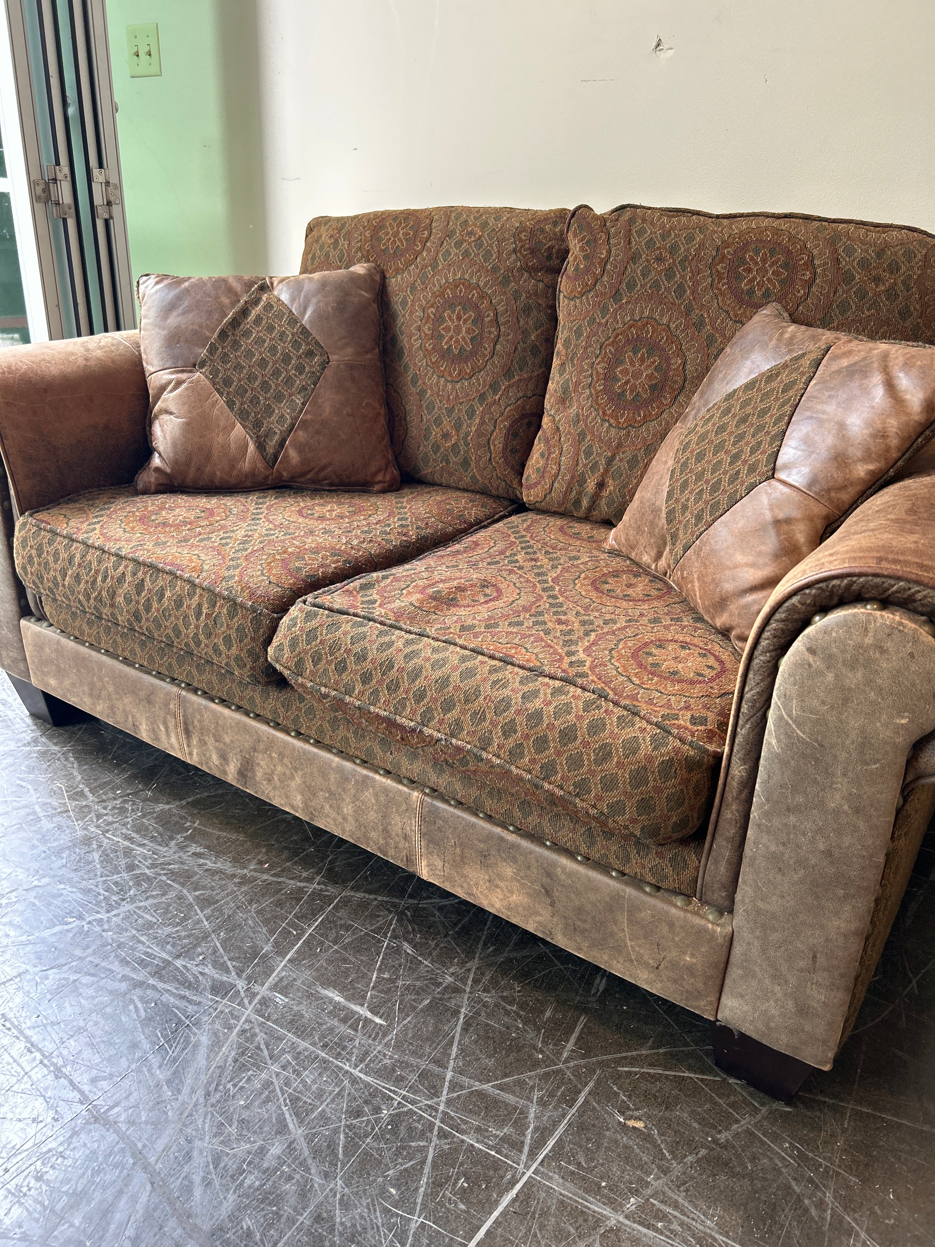 Brown and Rust Pattern Loveseat with Leather Accent