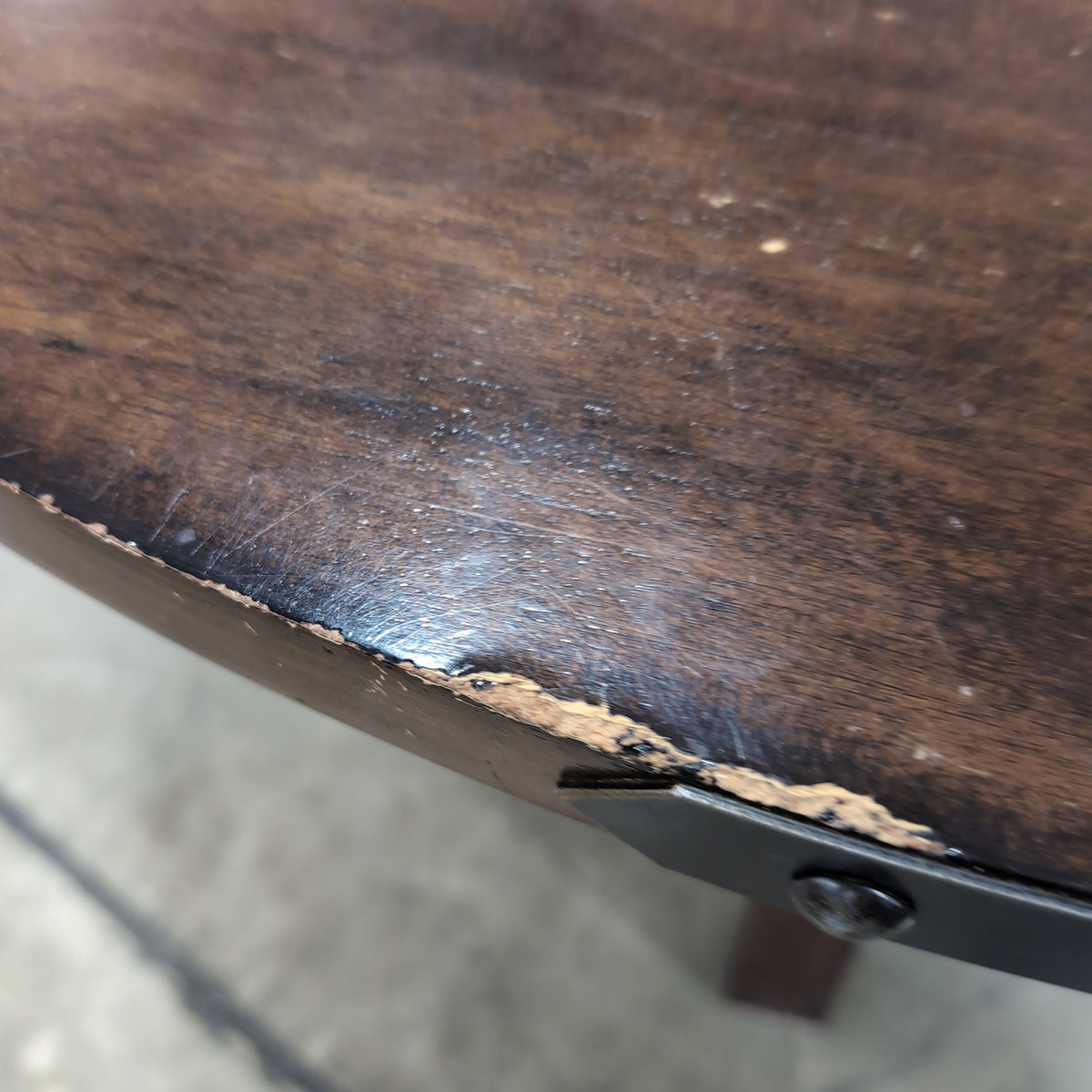 Rustic Dark Wood Round Dining Table with Metal Accents
