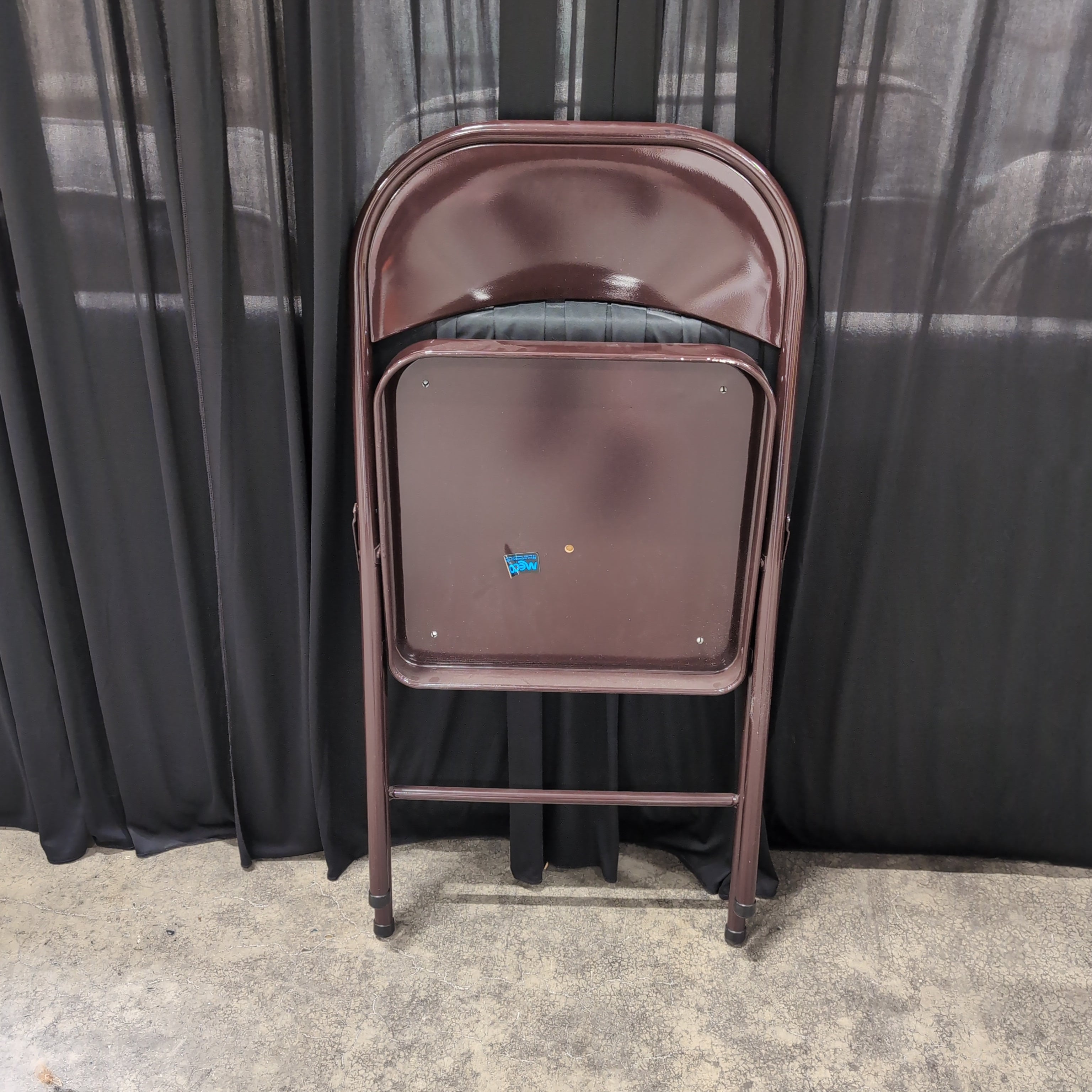 Brown Metal Folding Chair with Tan Upholstered Seat