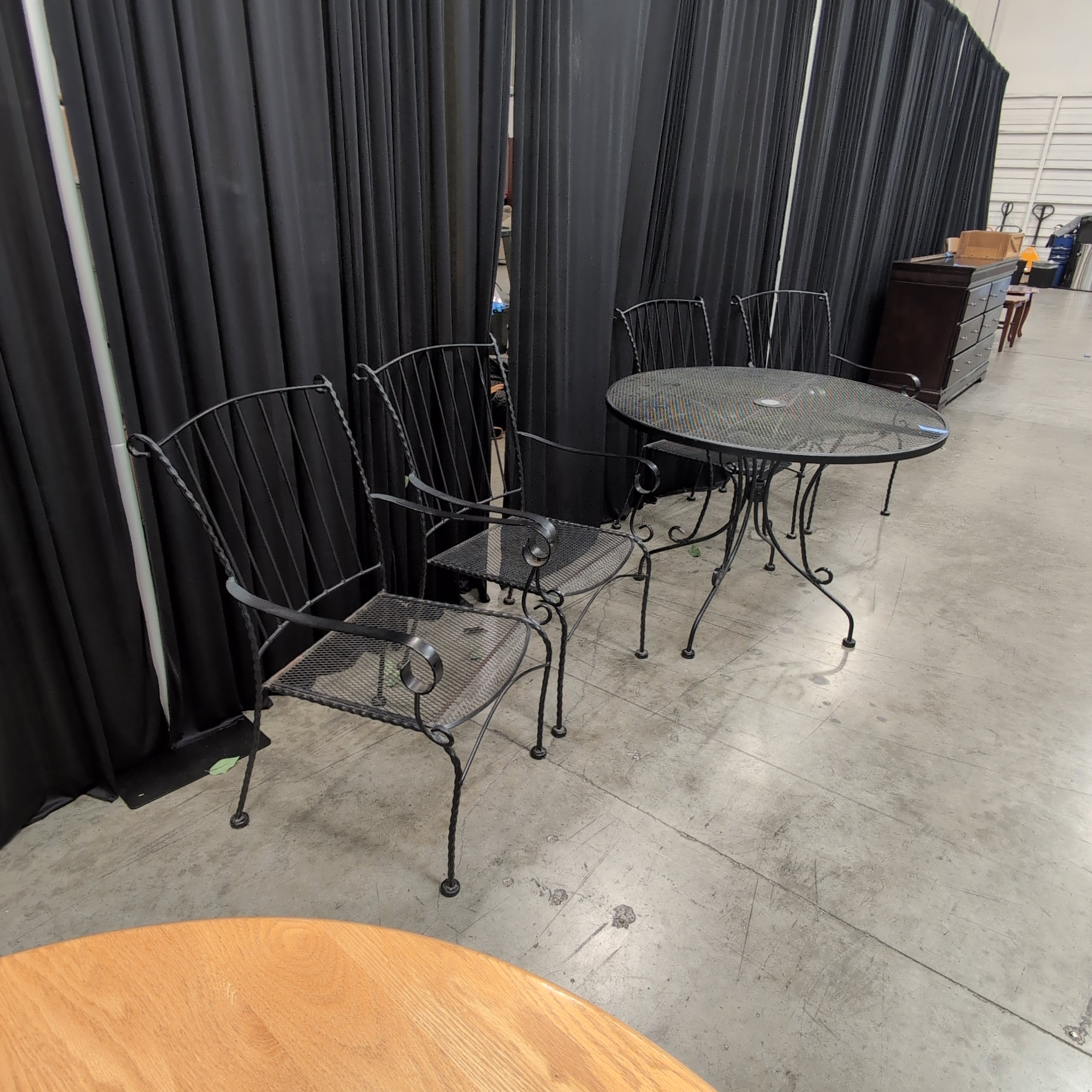 Black Wrought Iron Round Outdoor Table and Four Chairs