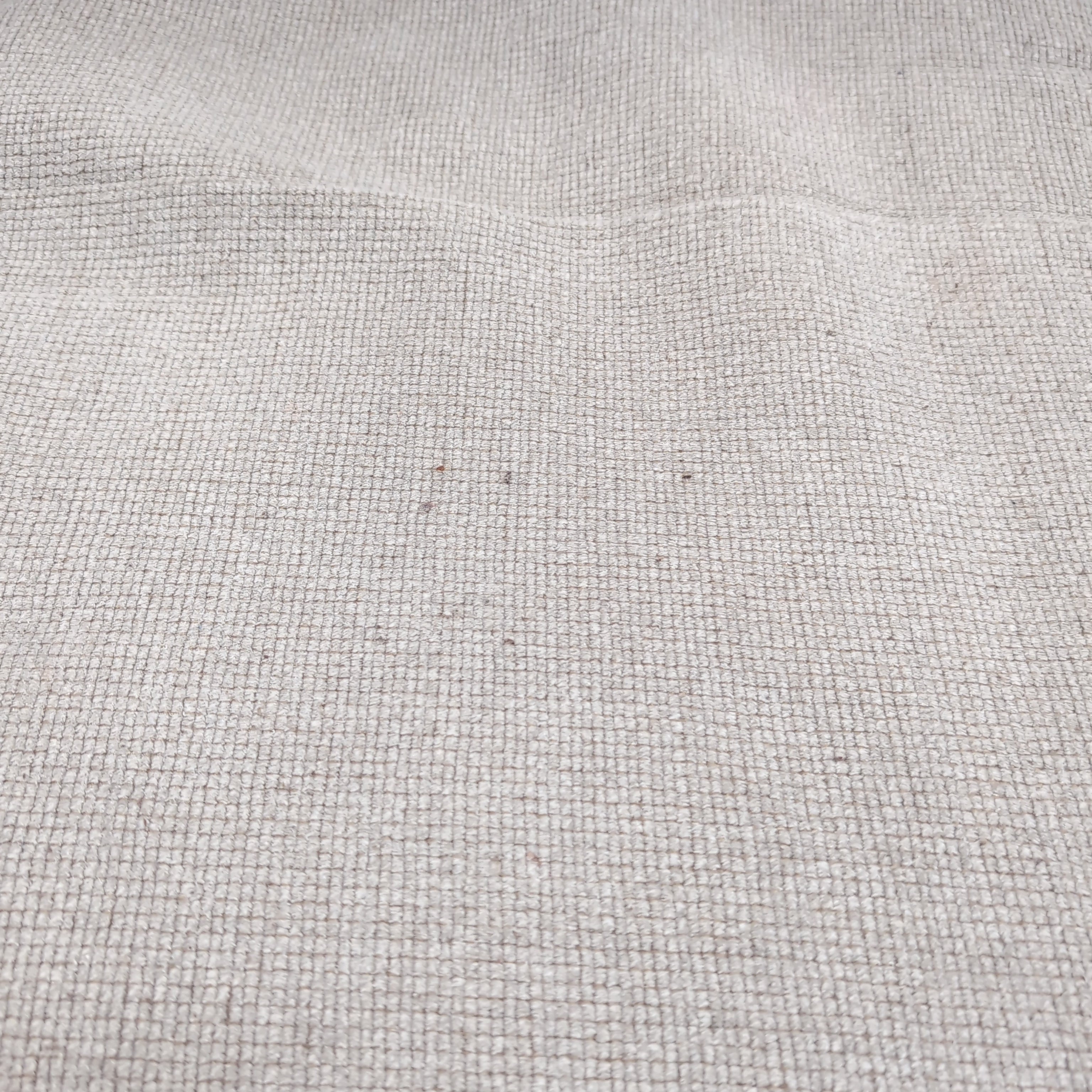Light Beige Upholstered Three-Seat Couch