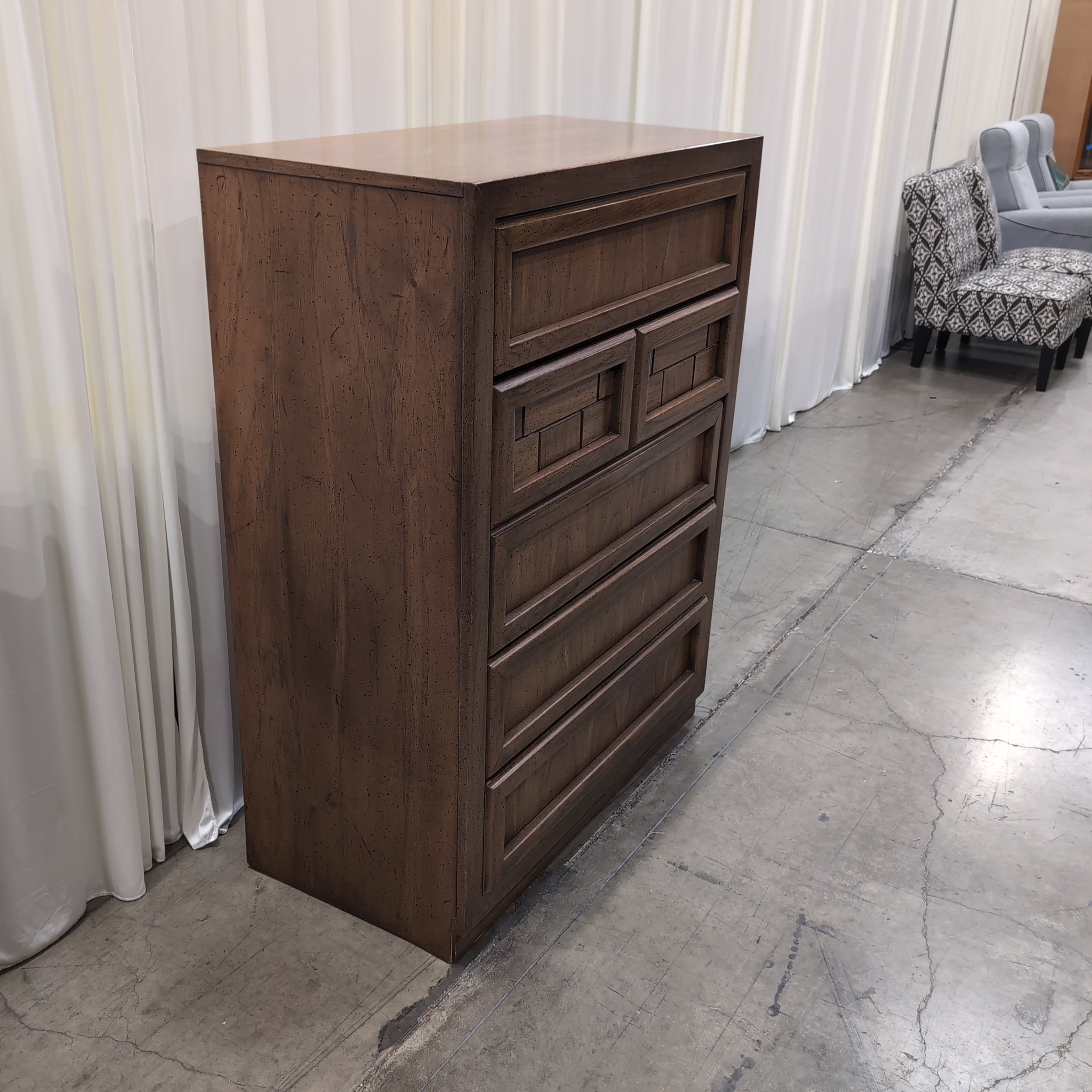 Honey Wood Five-Drawer Dresser with Geometric Top Panels