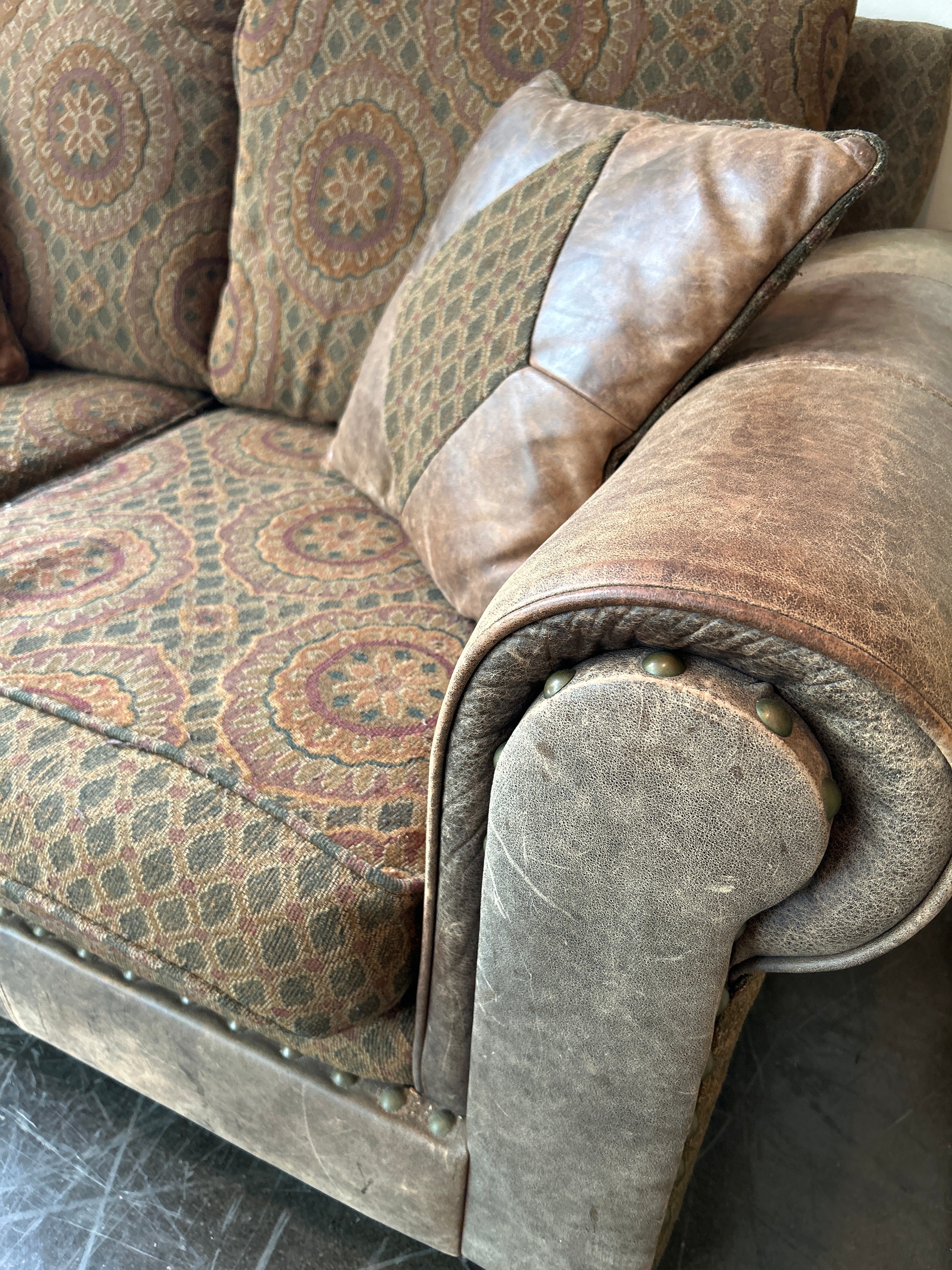 Brown and Rust Pattern Loveseat with Leather Accent