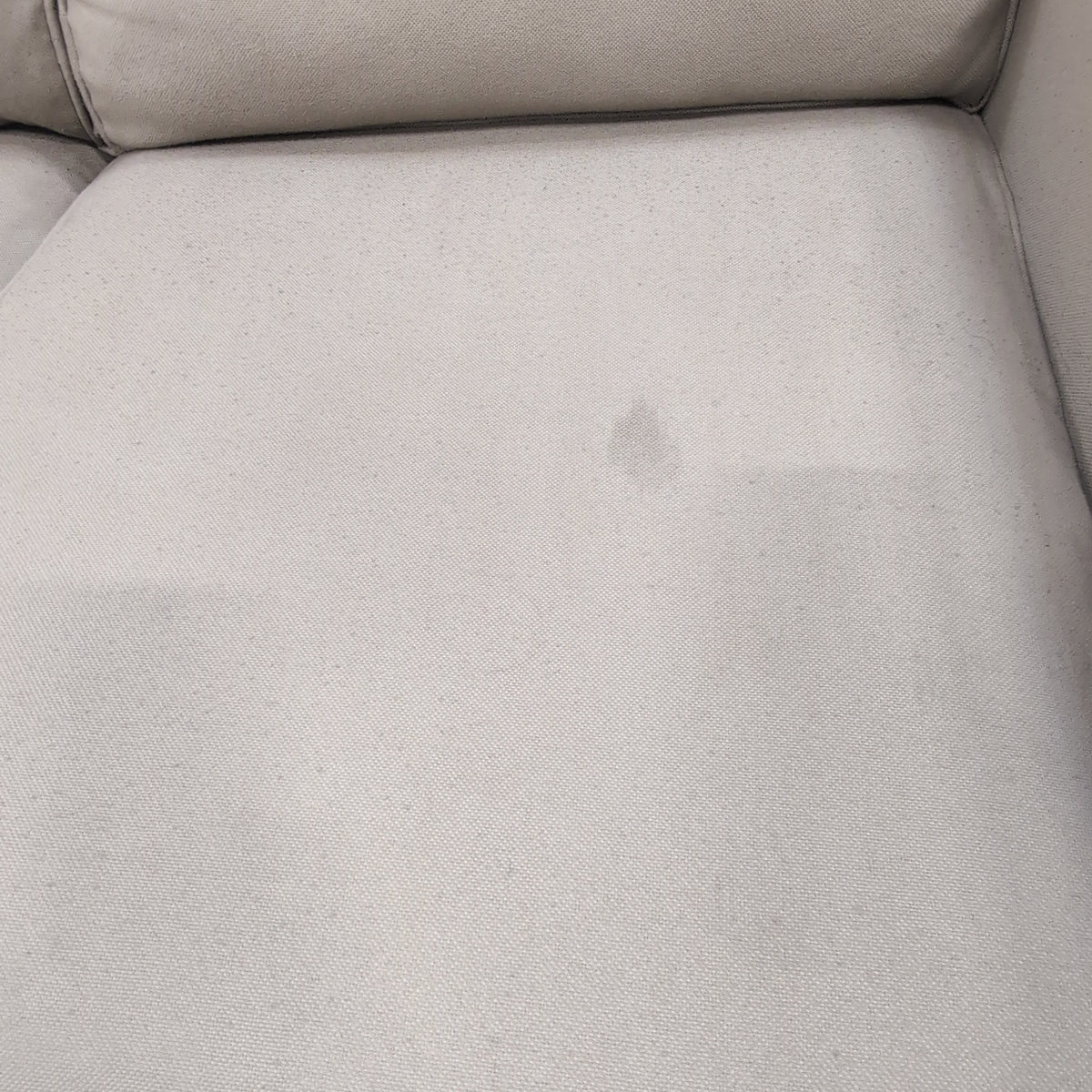 Tan Fabric Three-Cushion Couch with Rolled Arms