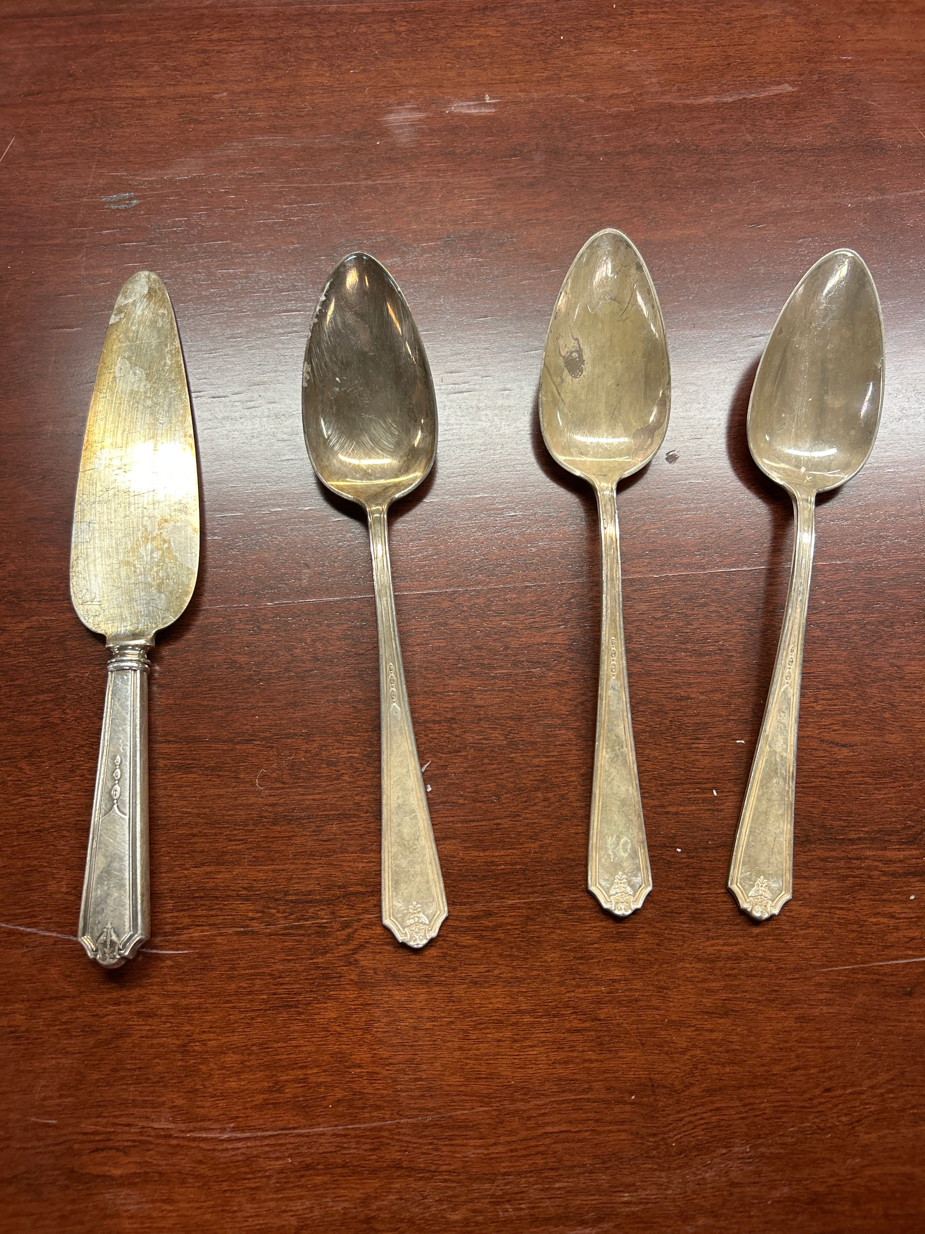 Serving knife and 3 serving spoons