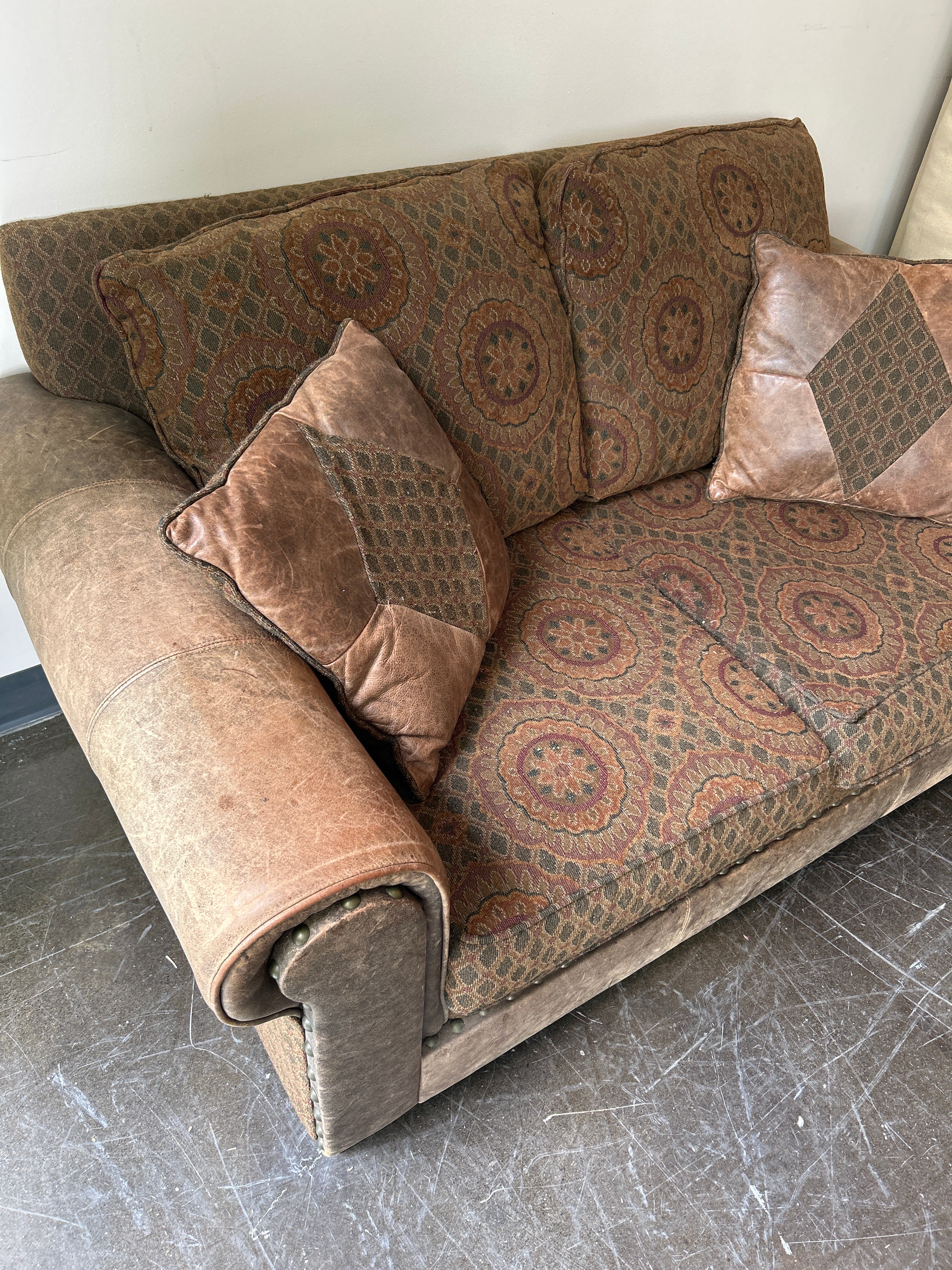 Brown and Rust Pattern Loveseat with Leather Accent