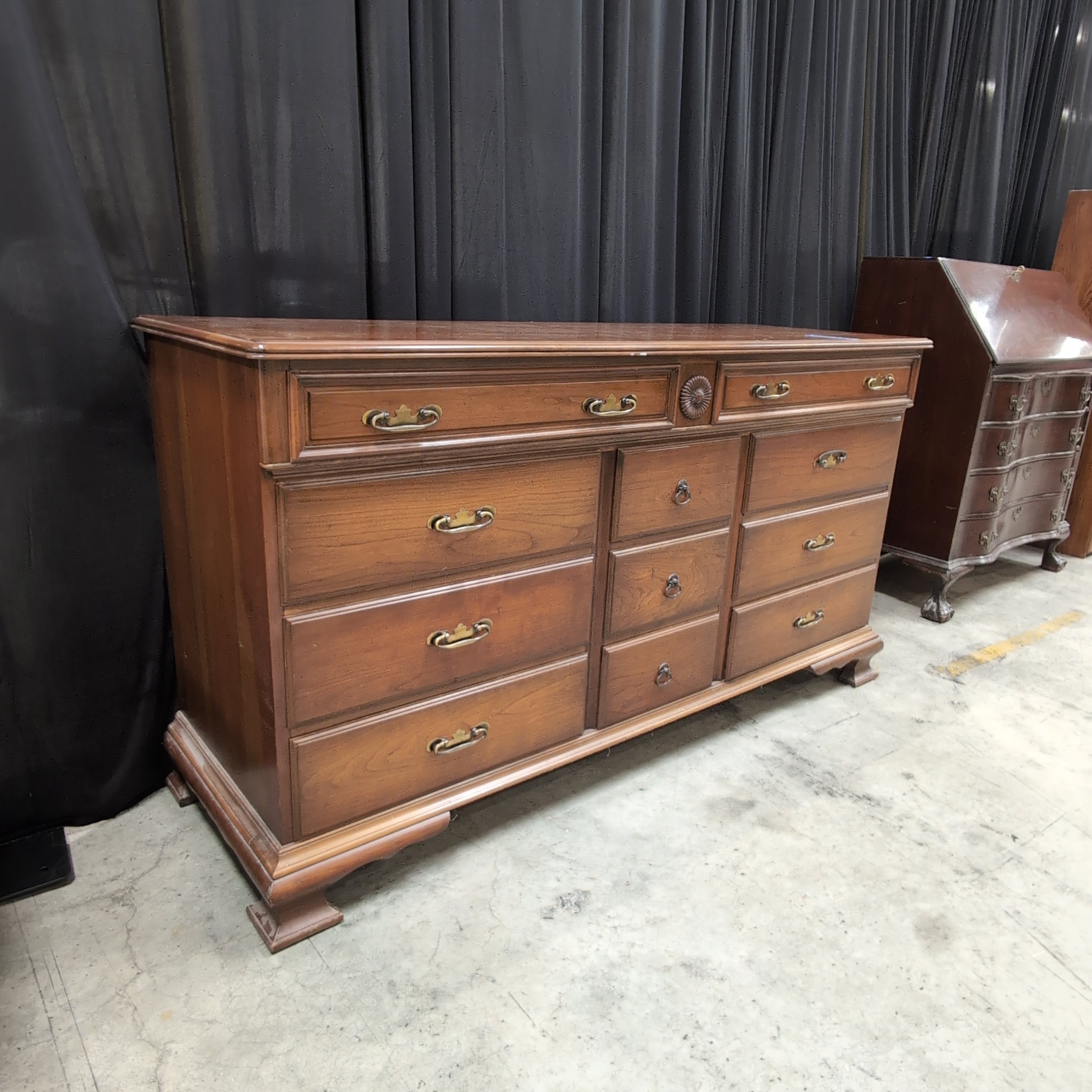 Traditional Brown Wood Dresser with Ornate Hardware