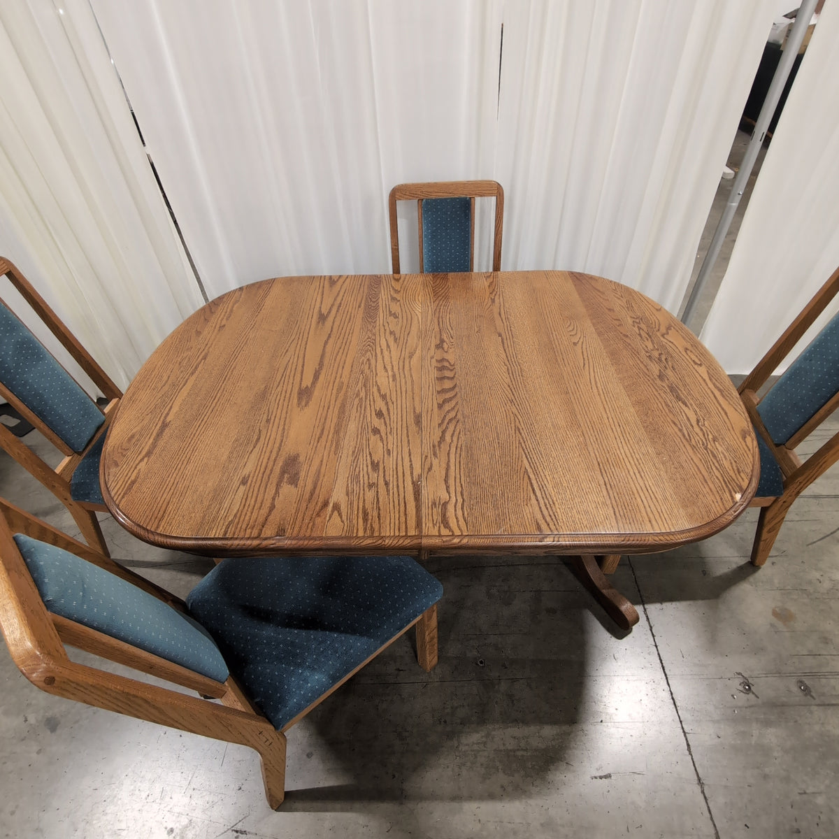 Reddish Brown Oval Pedestal Dining Table