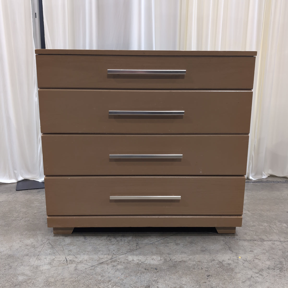 Light Wood Four-Drawer Dresser with Silver Bar Pulls