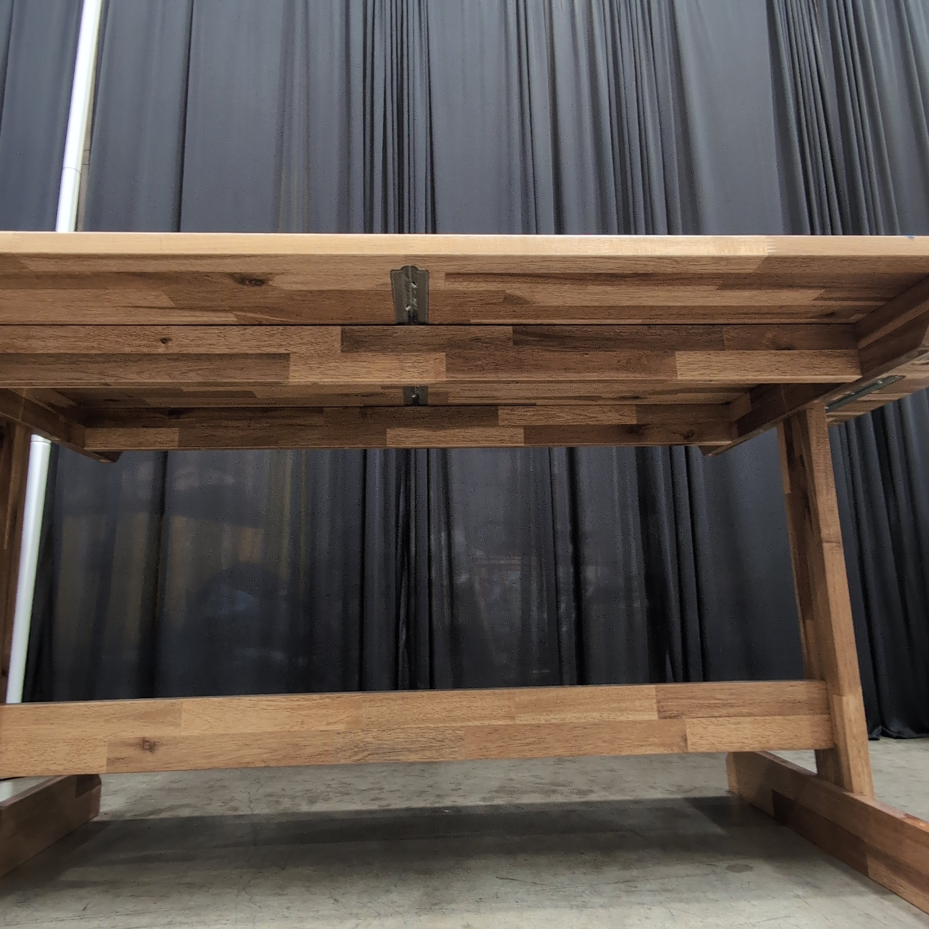 Warm Brown Wood Dining Table with Trestle Base