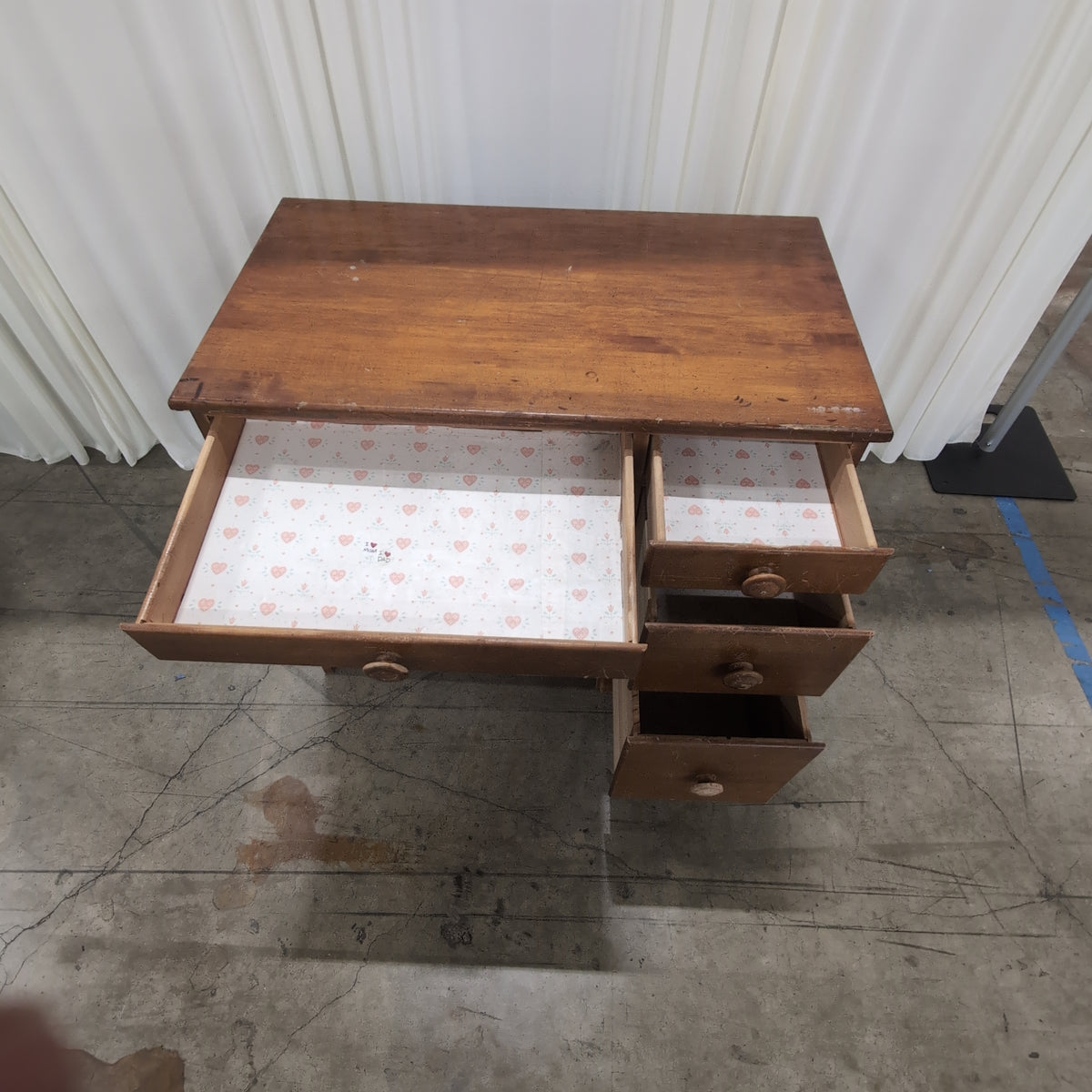 Brown Wood Four-Drawer Desk with Round Knobs