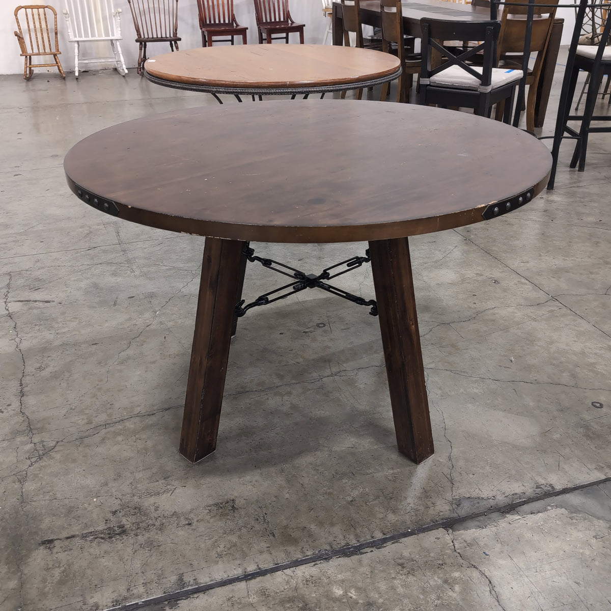 Rustic Dark Wood Round Dining Table with Metal Accents