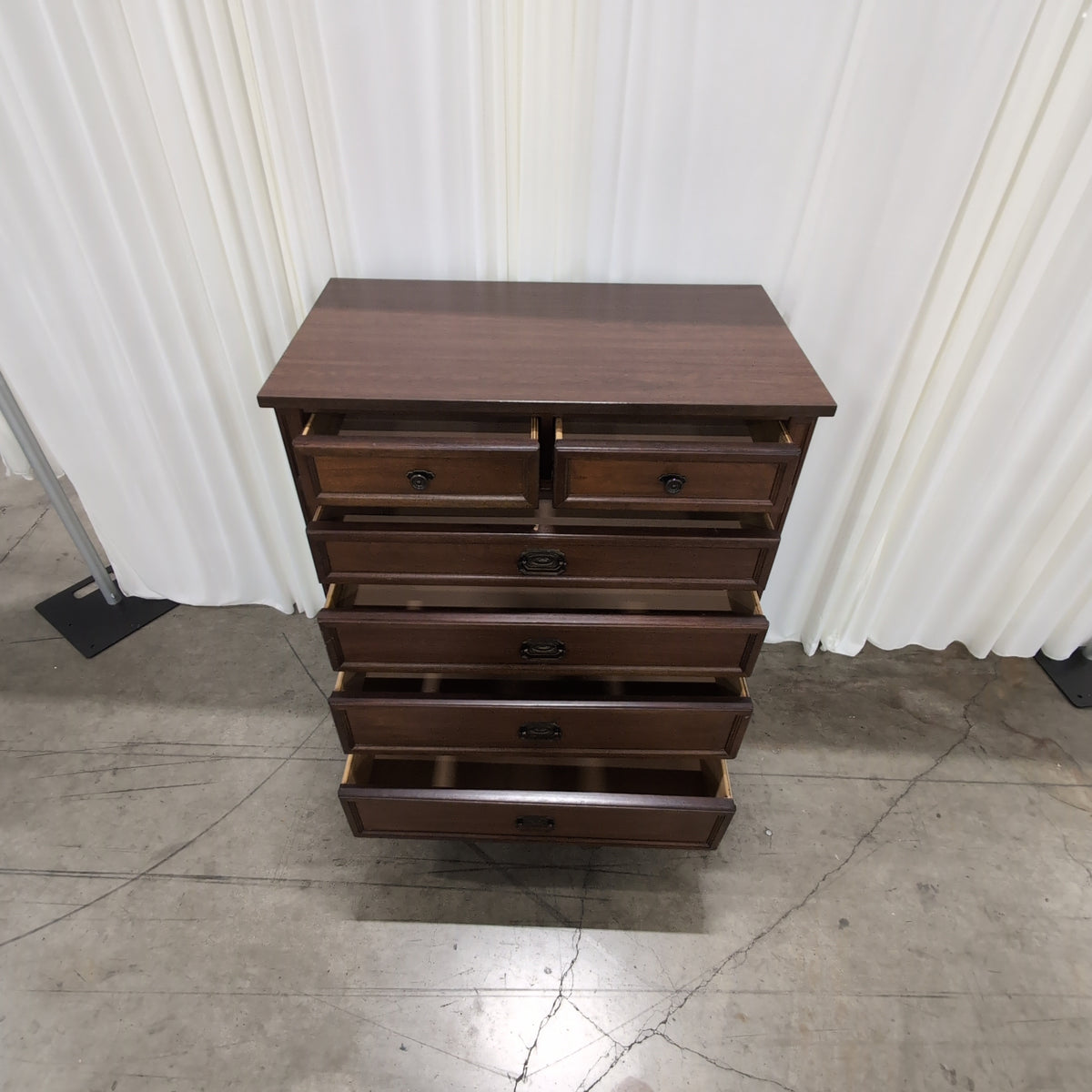 Brown Wood Six-Drawer Dresser with Ornate Hardware
