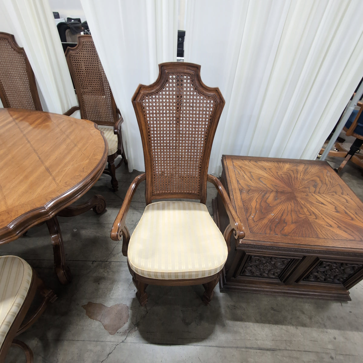 Ornate Brown Wood Dining Table With Six Cane Back Chairs