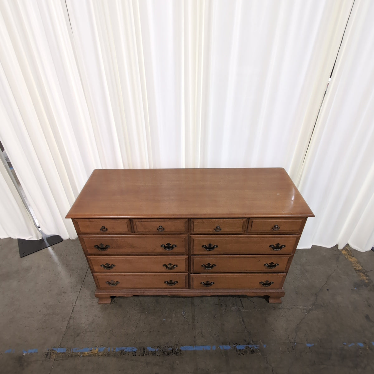 Traditional Honey Wood Nine-Drawer Dresser with Ornate Hardware
