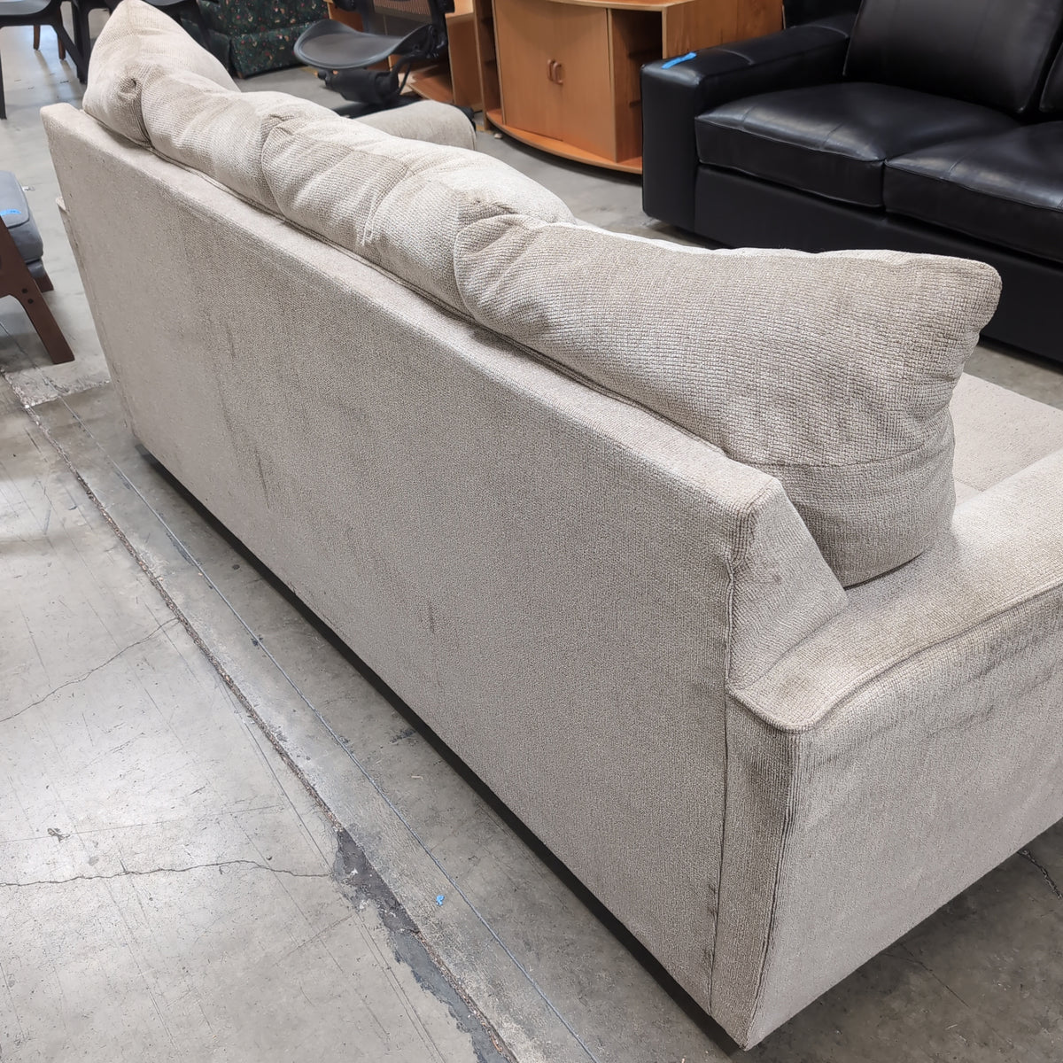 Light Beige Upholstered Three-Seat Couch