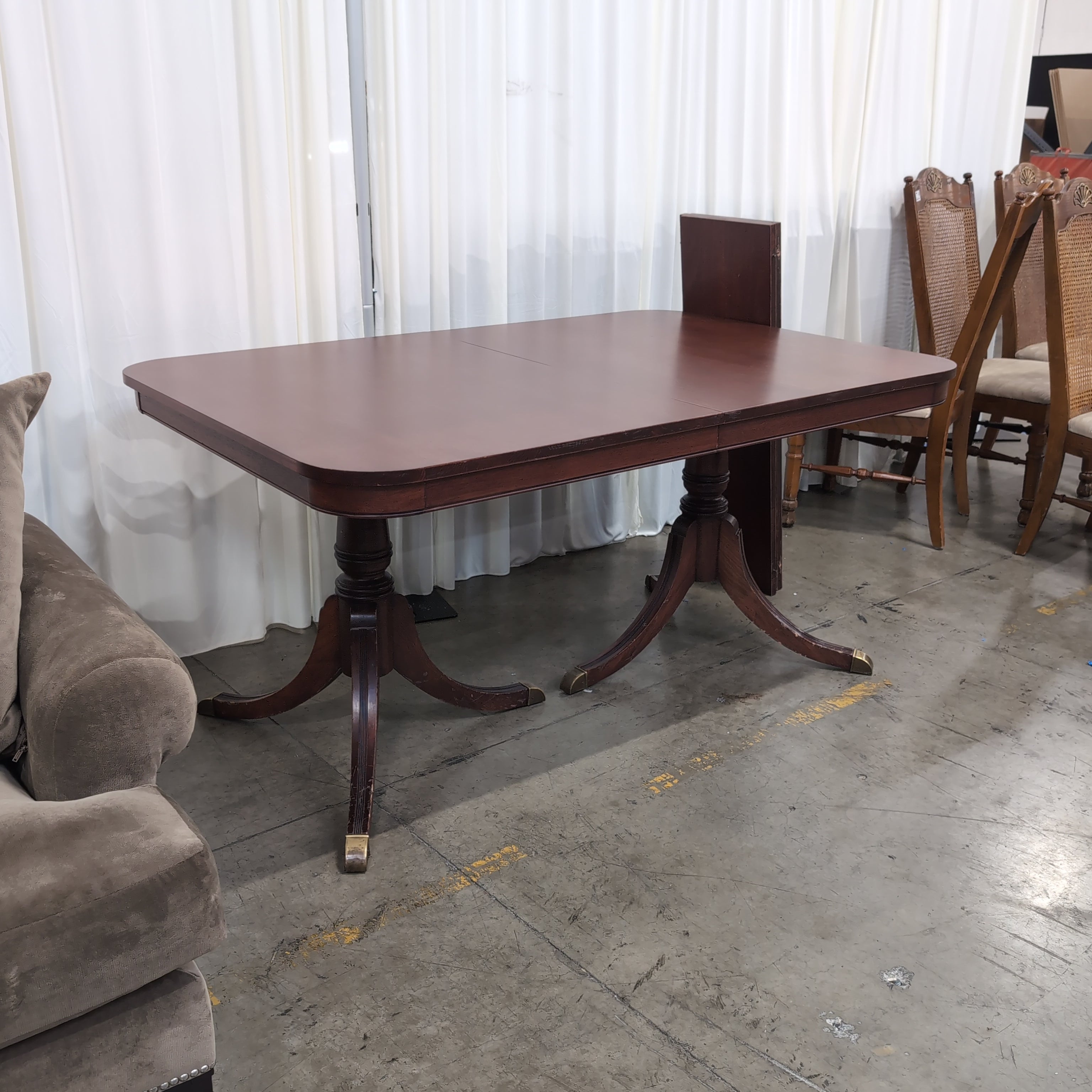 Reddish Brown Hardwood Dining Table with Rounded Corners